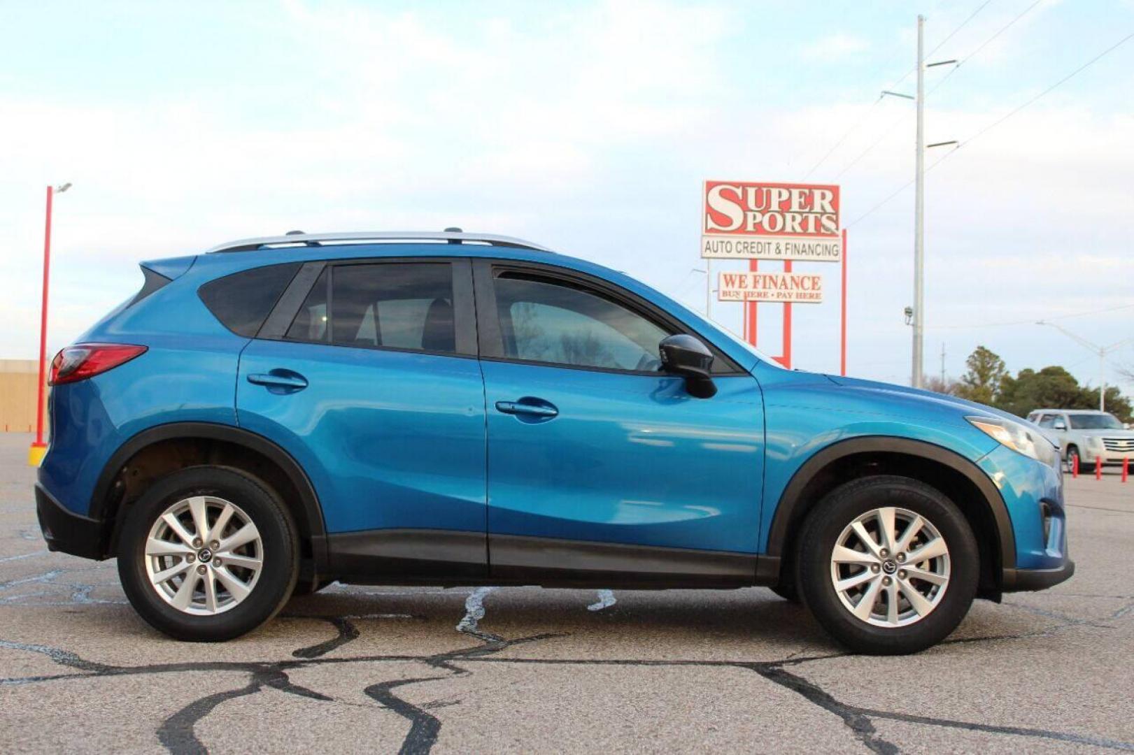 2014 Blue Mazda CX-5 Grand Touring (JM3KE2DY0E0) with an 2.5L L4 DOHC 16V engine, 6-Speed Automatic transmission, located at 4301 NW 39th , Oklahoma City, OK, 73112, (405) 949-5600, 35.512135, -97.598671 - NO DRIVERS LICENCE NO-FULL COVERAGE INSURANCE-NO CREDIT CHECK. COME ON OVER TO SUPERSPORTS AND TAKE A LOOK AND TEST DRIVE. PLEASE GIVE US A CALL AT (405) 949-5600. NO LICENSIA DE MANEJAR- NO SEGURO DE COBERTURA TOTAL- NO VERIFICACCION DE CREDITO. POR FAVOR VENGAN A SUPERSPORTS, ECHE UN - Photo#3