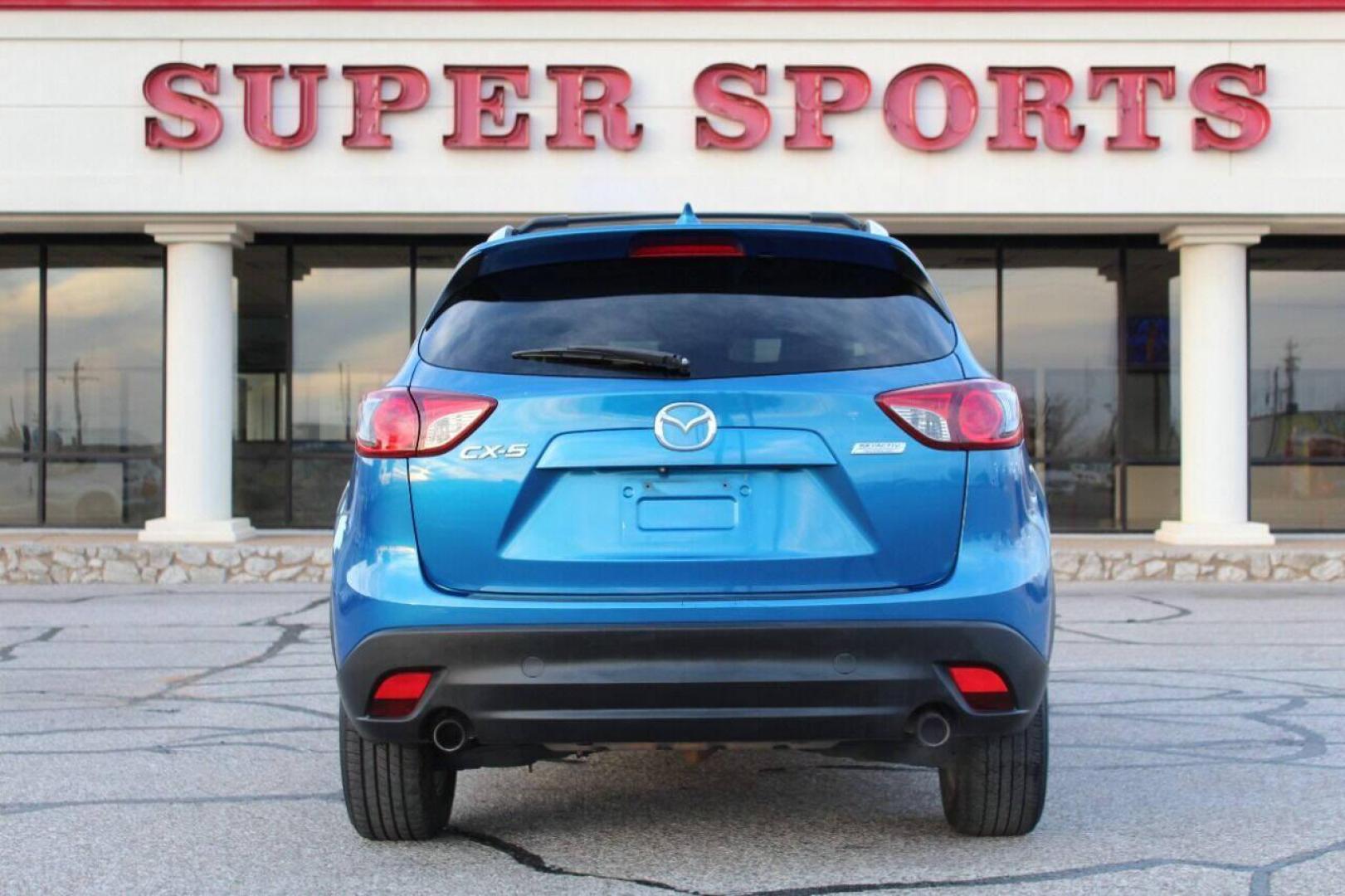 2014 Blue Mazda CX-5 Grand Touring (JM3KE2DY0E0) with an 2.5L L4 DOHC 16V engine, 6-Speed Automatic transmission, located at 4301 NW 39th , Oklahoma City, OK, 73112, (405) 949-5600, 35.512135, -97.598671 - NO DRIVERS LICENCE NO-FULL COVERAGE INSURANCE-NO CREDIT CHECK. COME ON OVER TO SUPERSPORTS AND TAKE A LOOK AND TEST DRIVE. PLEASE GIVE US A CALL AT (405) 949-5600. NO LICENSIA DE MANEJAR- NO SEGURO DE COBERTURA TOTAL- NO VERIFICACCION DE CREDITO. POR FAVOR VENGAN A SUPERSPORTS, ECHE UN - Photo#4