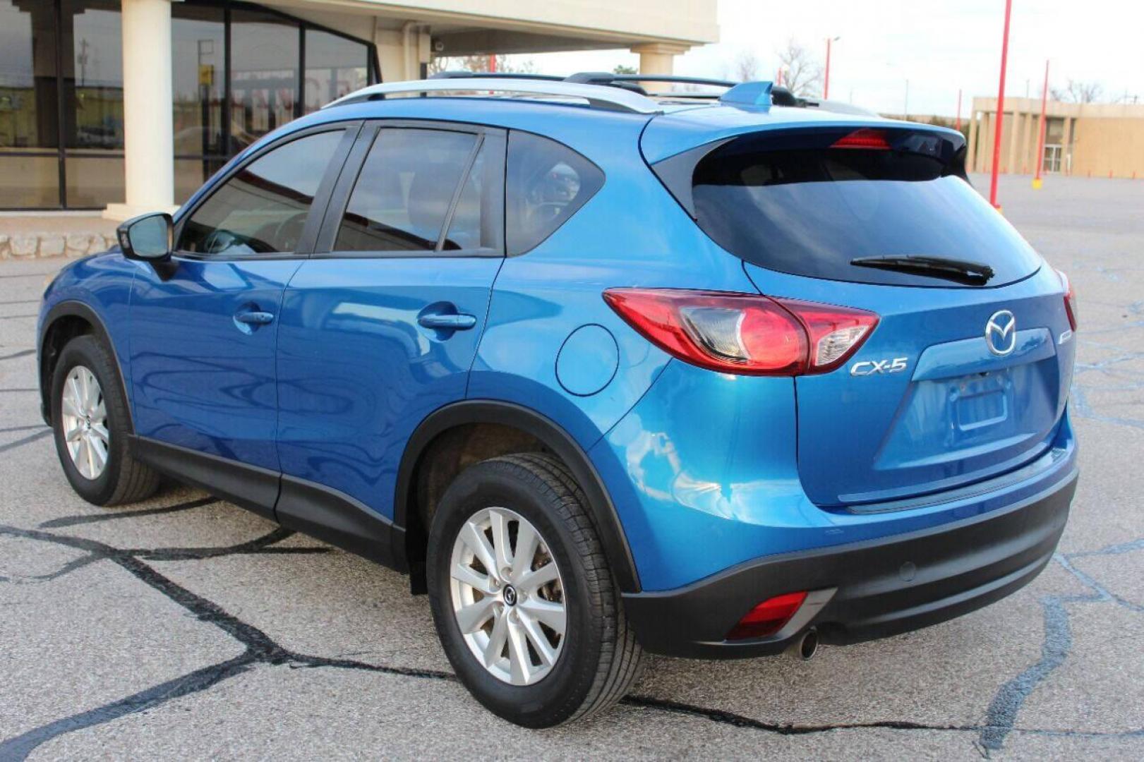 2014 Blue Mazda CX-5 Grand Touring (JM3KE2DY0E0) with an 2.5L L4 DOHC 16V engine, 6-Speed Automatic transmission, located at 4301 NW 39th , Oklahoma City, OK, 73112, (405) 949-5600, 35.512135, -97.598671 - NO DRIVERS LICENCE NO-FULL COVERAGE INSURANCE-NO CREDIT CHECK. COME ON OVER TO SUPERSPORTS AND TAKE A LOOK AND TEST DRIVE. PLEASE GIVE US A CALL AT (405) 949-5600. NO LICENSIA DE MANEJAR- NO SEGURO DE COBERTURA TOTAL- NO VERIFICACCION DE CREDITO. POR FAVOR VENGAN A SUPERSPORTS, ECHE UN - Photo#5