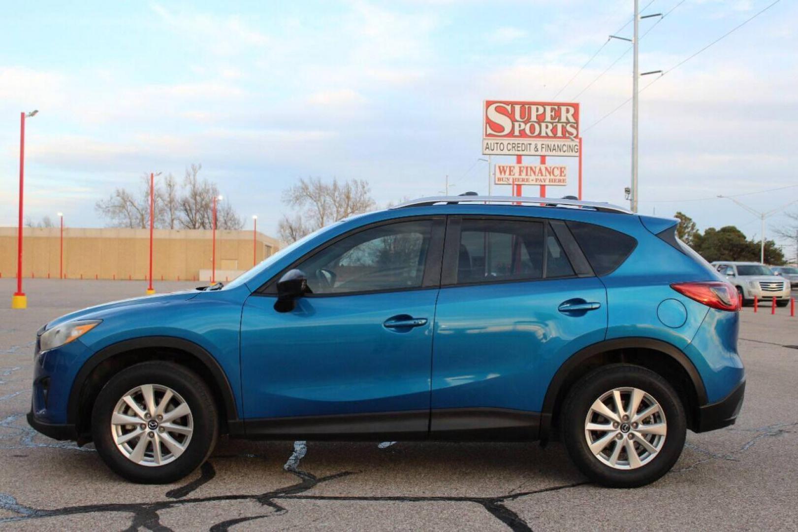 2014 Blue Mazda CX-5 Grand Touring (JM3KE2DY0E0) with an 2.5L L4 DOHC 16V engine, 6-Speed Automatic transmission, located at 4301 NW 39th , Oklahoma City, OK, 73112, (405) 949-5600, 35.512135, -97.598671 - NO DRIVERS LICENCE NO-FULL COVERAGE INSURANCE-NO CREDIT CHECK. COME ON OVER TO SUPERSPORTS AND TAKE A LOOK AND TEST DRIVE. PLEASE GIVE US A CALL AT (405) 949-5600. NO LICENSIA DE MANEJAR- NO SEGURO DE COBERTURA TOTAL- NO VERIFICACCION DE CREDITO. POR FAVOR VENGAN A SUPERSPORTS, ECHE UN - Photo#6