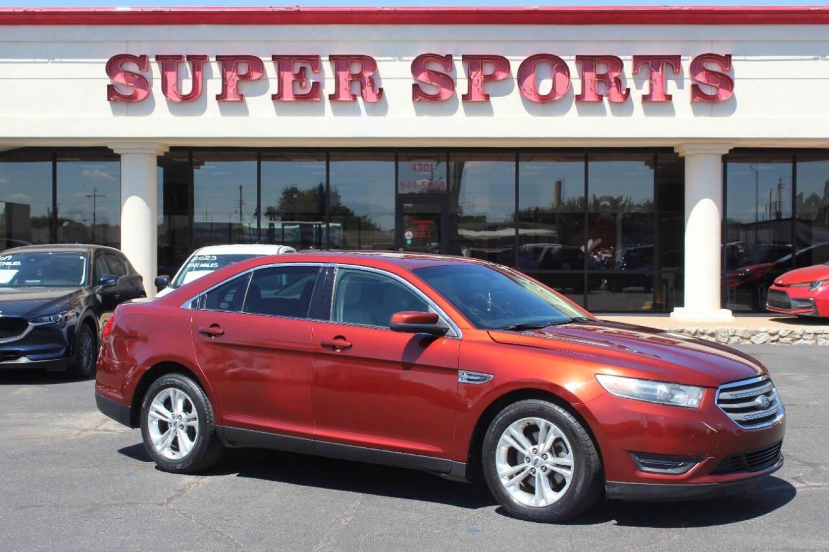 2014 Red Ford Taurus SEL FWD (1FAHP2E83EG) with an 3.5L V6 DOHC 24V engine, 6-Speed Automatic transmission, located at 4301 NW 39th , Oklahoma City, OK, 73112, (405) 949-5600, 35.512135, -97.598671 - NO DRIVERS LICENCE NO-FULL COVERAGE INSURANCE-NO CREDIT CHECK. COME ON OVER TO SUPERSPORTS AND TAKE A LOOK AND TEST DRIVE. PLEASE GIVE US A CALL AT (405) 949-5600. NO LICENSIA DE MANEJAR- NO SEGURO DE COBERTURA TOTAL- NO VERIFICACCION DE CREDITO. POR FAVOR VENGAN A SUPERSPORTS, ECHE UN - Photo#0