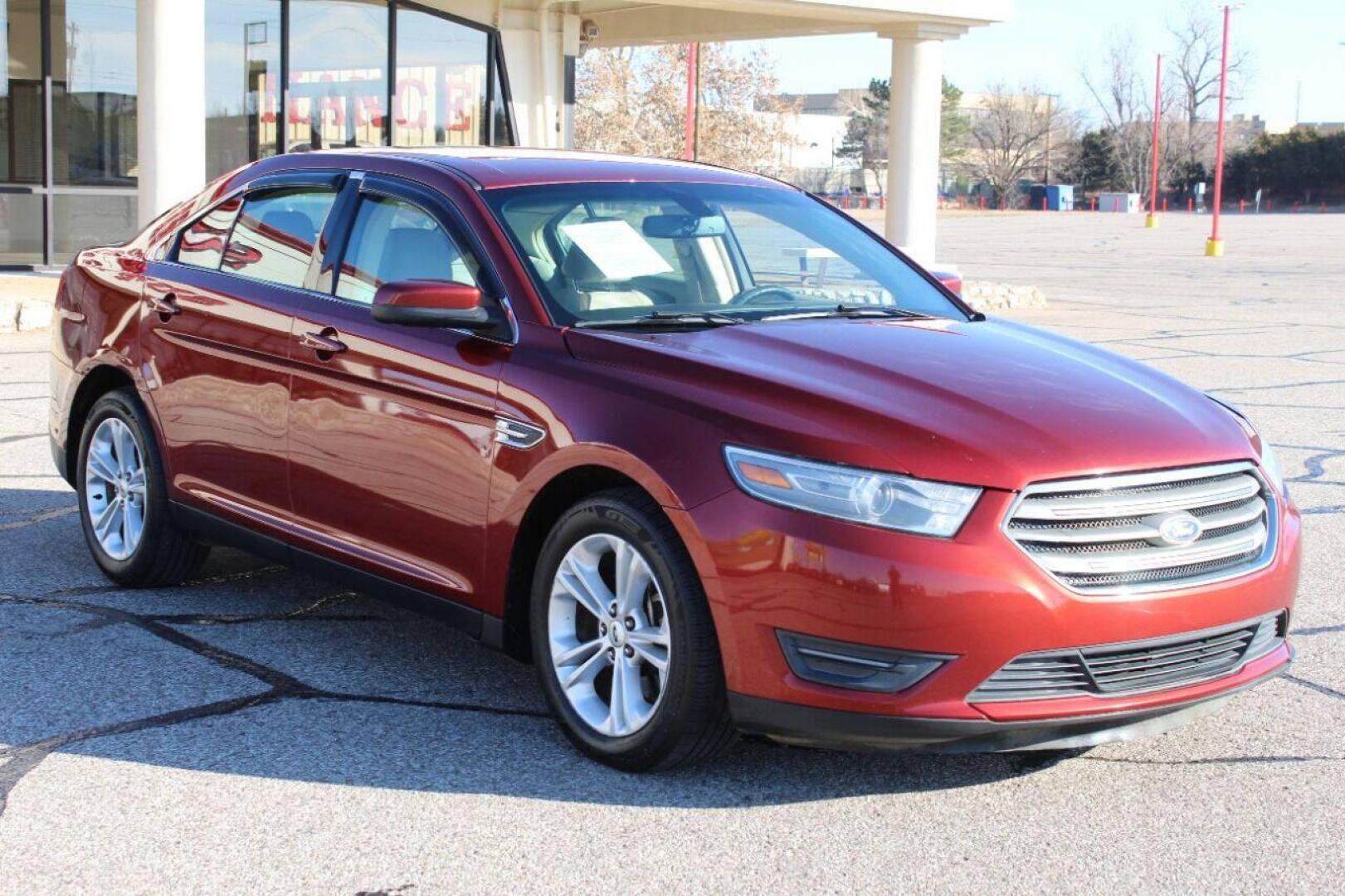 2014 Red Ford Taurus SEL FWD (1FAHP2E83EG) with an 3.5L V6 DOHC 24V engine, 6-Speed Automatic transmission, located at 4301 NW 39th , Oklahoma City, OK, 73112, (405) 949-5600, 35.512135, -97.598671 - NO DRIVERS LICENCE NO-FULL COVERAGE INSURANCE-NO CREDIT CHECK. COME ON OVER TO SUPERSPORTS AND TAKE A LOOK AND TEST DRIVE. PLEASE GIVE US A CALL AT (405) 949-5600. NO LICENSIA DE MANEJAR- NO SEGURO DE COBERTURA TOTAL- NO VERIFICACCION DE CREDITO. POR FAVOR VENGAN A SUPERSPORTS, ECHE UN - Photo#1