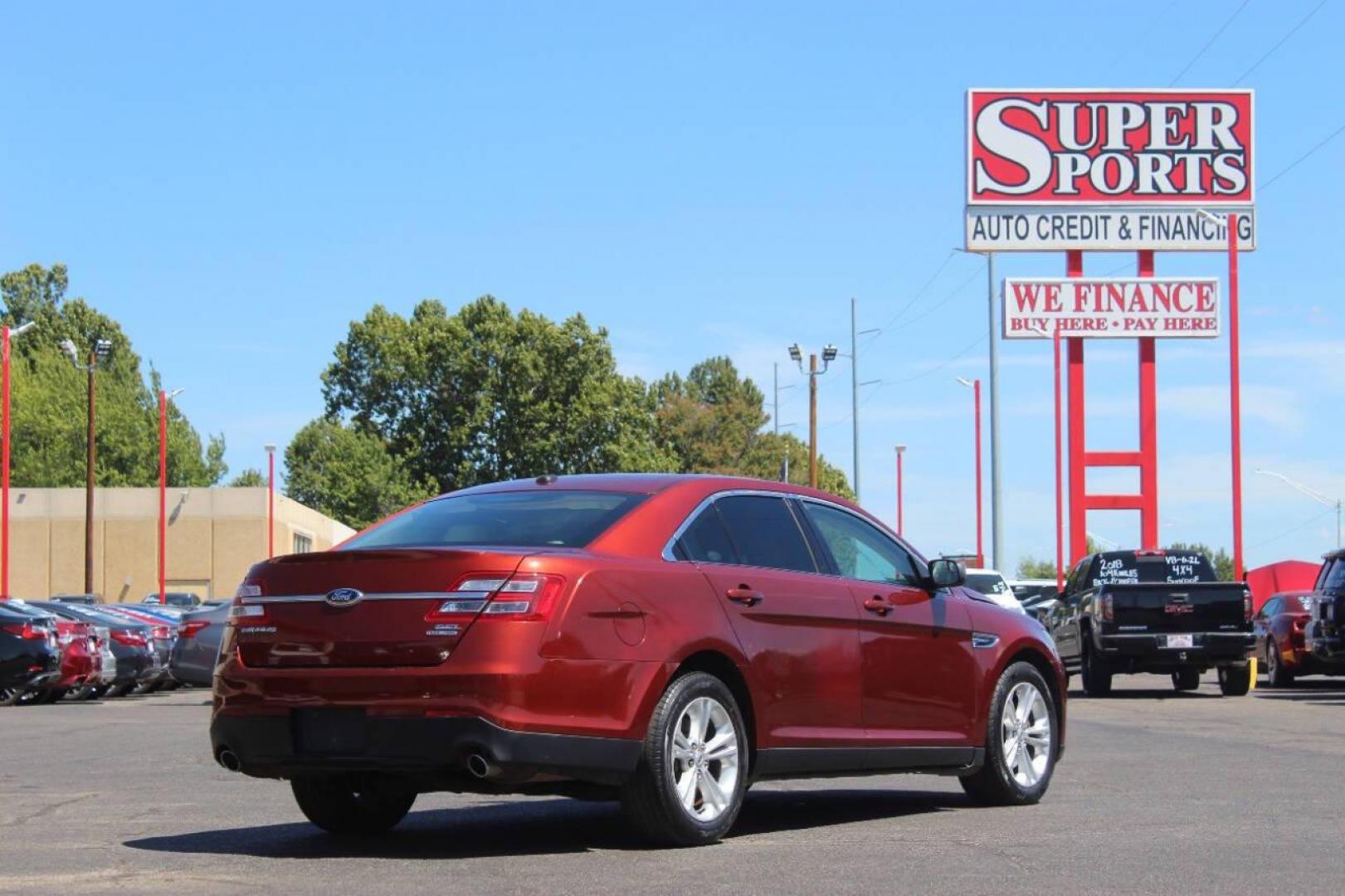 2014 Red Ford Taurus SEL FWD (1FAHP2E83EG) with an 3.5L V6 DOHC 24V engine, 6-Speed Automatic transmission, located at 4301 NW 39th , Oklahoma City, OK, 73112, (405) 949-5600, 35.512135, -97.598671 - NO DRIVERS LICENCE NO-FULL COVERAGE INSURANCE-NO CREDIT CHECK. COME ON OVER TO SUPERSPORTS AND TAKE A LOOK AND TEST DRIVE. PLEASE GIVE US A CALL AT (405) 949-5600. NO LICENSIA DE MANEJAR- NO SEGURO DE COBERTURA TOTAL- NO VERIFICACCION DE CREDITO. POR FAVOR VENGAN A SUPERSPORTS, ECHE UN - Photo#2