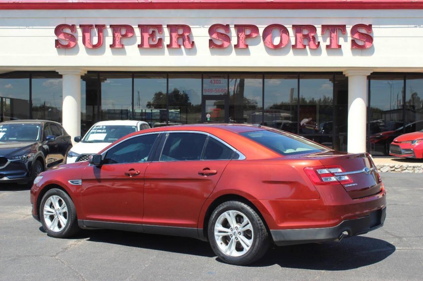 2014 Red Ford Taurus SEL FWD (1FAHP2E83EG) with an 3.5L V6 DOHC 24V engine, 6-Speed Automatic transmission, located at 4301 NW 39th , Oklahoma City, OK, 73112, (405) 949-5600, 35.512135, -97.598671 - NO DRIVERS LICENCE NO-FULL COVERAGE INSURANCE-NO CREDIT CHECK. COME ON OVER TO SUPERSPORTS AND TAKE A LOOK AND TEST DRIVE. PLEASE GIVE US A CALL AT (405) 949-5600. NO LICENSIA DE MANEJAR- NO SEGURO DE COBERTURA TOTAL- NO VERIFICACCION DE CREDITO. POR FAVOR VENGAN A SUPERSPORTS, ECHE UN - Photo#3