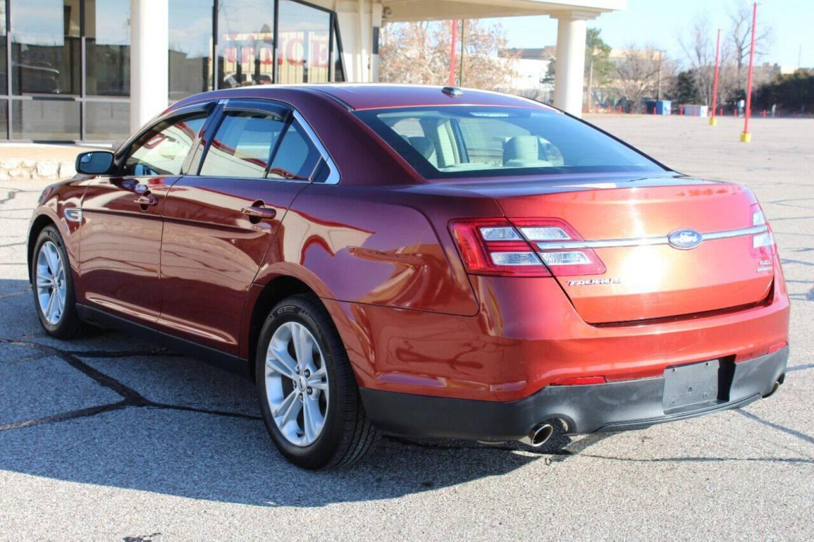 2014 Red Ford Taurus SEL FWD (1FAHP2E83EG) with an 3.5L V6 DOHC 24V engine, 6-Speed Automatic transmission, located at 4301 NW 39th , Oklahoma City, OK, 73112, (405) 949-5600, 35.512135, -97.598671 - NO DRIVERS LICENCE NO-FULL COVERAGE INSURANCE-NO CREDIT CHECK. COME ON OVER TO SUPERSPORTS AND TAKE A LOOK AND TEST DRIVE. PLEASE GIVE US A CALL AT (405) 949-5600. NO LICENSIA DE MANEJAR- NO SEGURO DE COBERTURA TOTAL- NO VERIFICACCION DE CREDITO. POR FAVOR VENGAN A SUPERSPORTS, ECHE UN - Photo#4