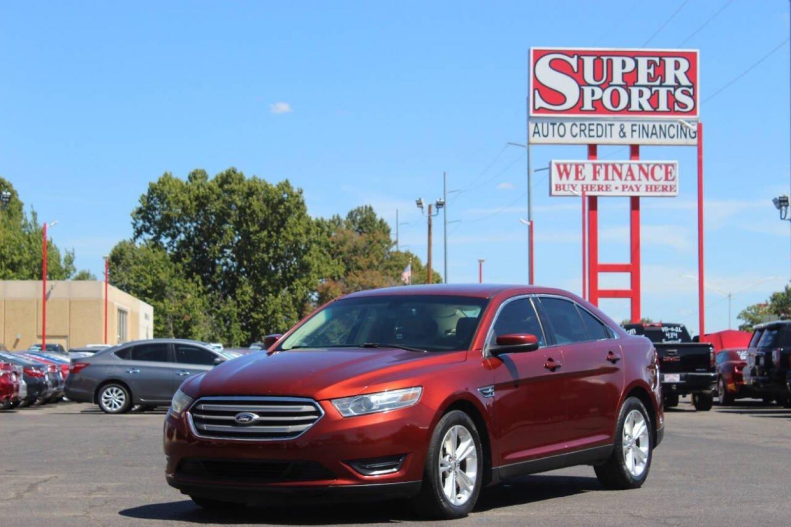 2014 Red Ford Taurus SEL FWD (1FAHP2E83EG) with an 3.5L V6 DOHC 24V engine, 6-Speed Automatic transmission, located at 4301 NW 39th , Oklahoma City, OK, 73112, (405) 949-5600, 35.512135, -97.598671 - NO DRIVERS LICENCE NO-FULL COVERAGE INSURANCE-NO CREDIT CHECK. COME ON OVER TO SUPERSPORTS AND TAKE A LOOK AND TEST DRIVE. PLEASE GIVE US A CALL AT (405) 949-5600. NO LICENSIA DE MANEJAR- NO SEGURO DE COBERTURA TOTAL- NO VERIFICACCION DE CREDITO. POR FAVOR VENGAN A SUPERSPORTS, ECHE UN - Photo#5