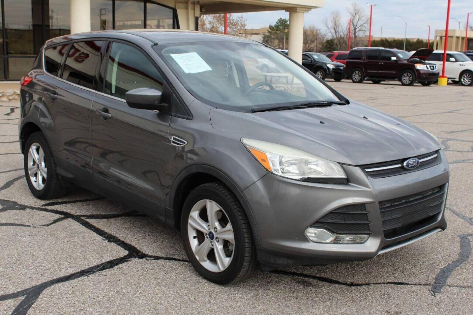 2014 Gray Ford Escape (1FMCU0GX4EU) with an 1.6L I4 Turbocharger 1.6L I4 engine, Automatic 6-Speed transmission, located at 4301 NW 39th , Oklahoma City, OK, 73112, (405) 949-5600, 35.512135, -97.598671 - Photo#2