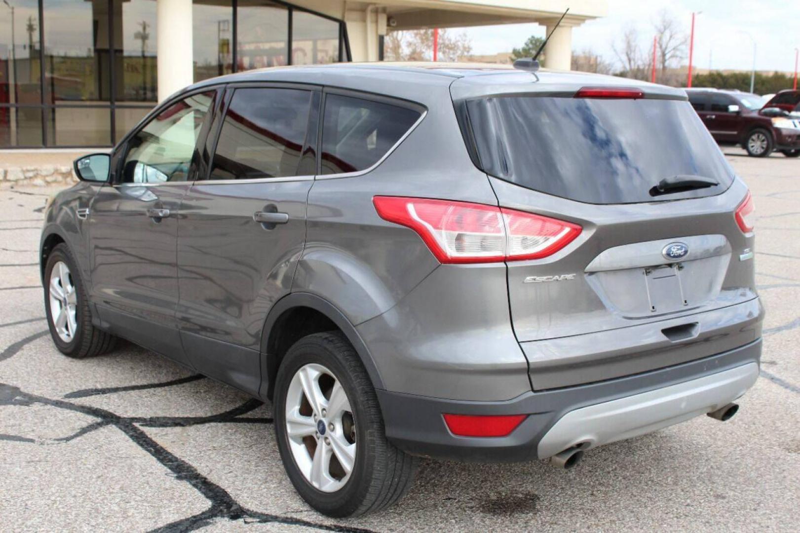 2014 Gray Ford Escape (1FMCU0GX4EU) with an 1.6L I4 Turbocharger 1.6L I4 engine, Automatic 6-Speed transmission, located at 4301 NW 39th , Oklahoma City, OK, 73112, (405) 949-5600, 35.512135, -97.598671 - Photo#5