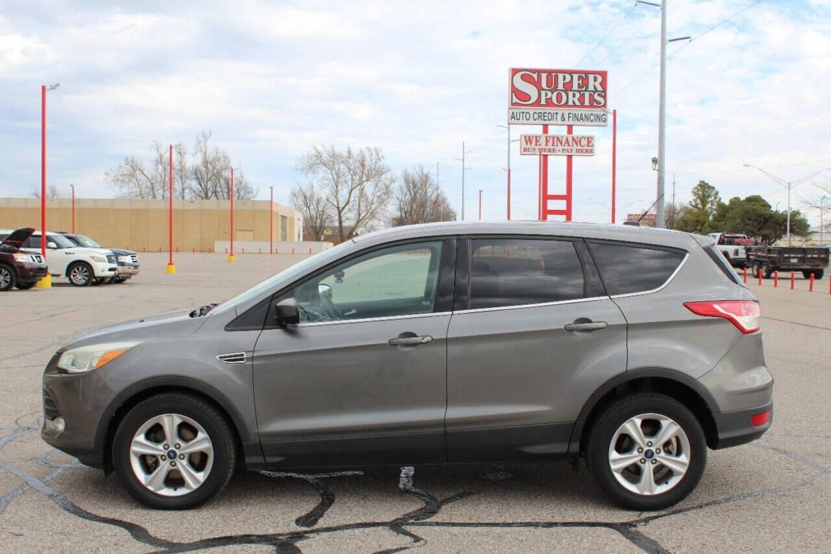 2014 Gray Ford Escape (1FMCU0GX4EU) with an 1.6L I4 Turbocharger 1.6L I4 engine, Automatic 6-Speed transmission, located at 4301 NW 39th , Oklahoma City, OK, 73112, (405) 949-5600, 35.512135, -97.598671 - Photo#6