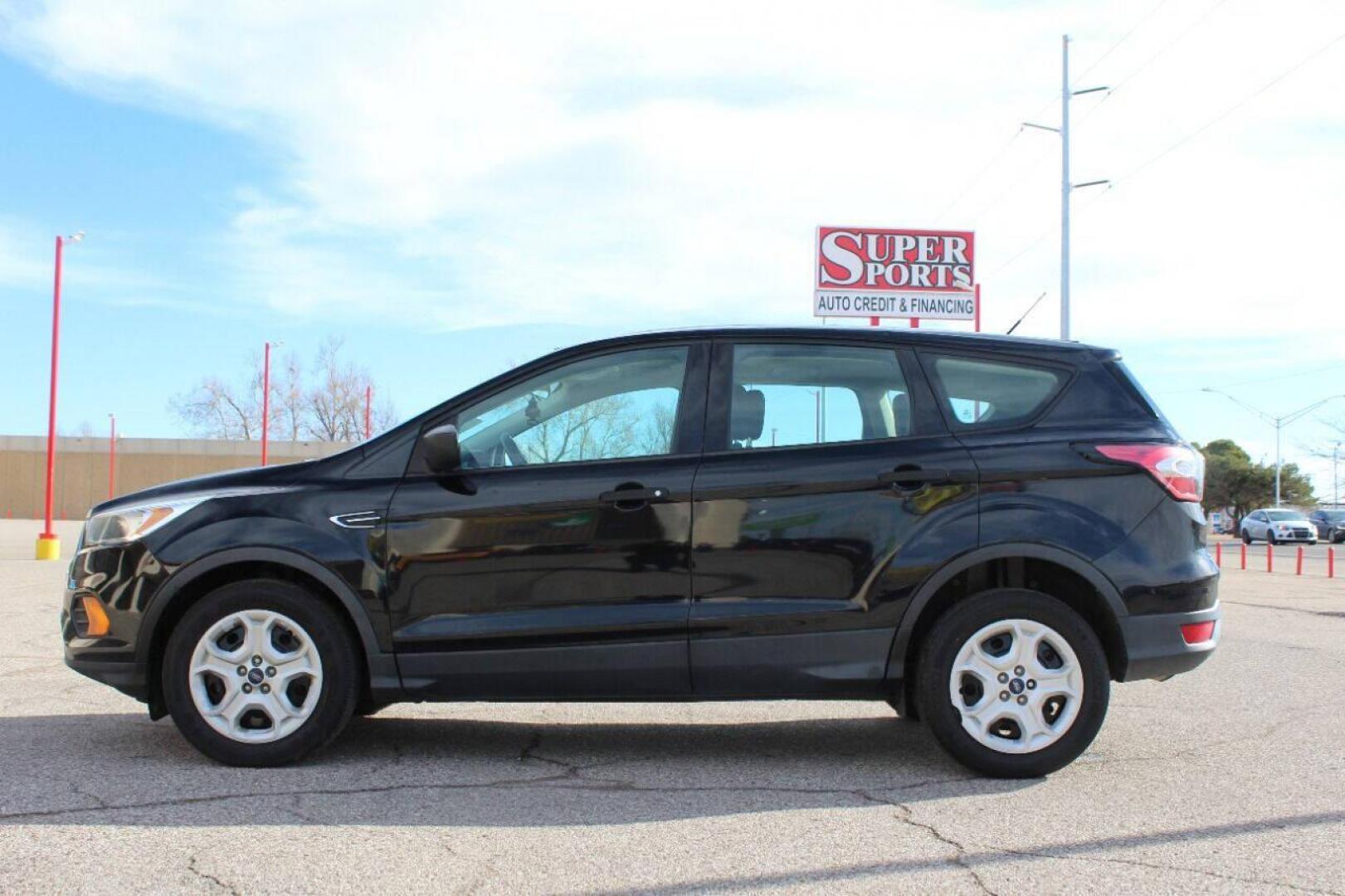 2017 Black Ford Escape (1FMCU0F73HU) with an 2.5L I4 2.5L I4 engine, Automatic 6-Speed transmission, located at 4301 NW 39th , Oklahoma City, OK, 73112, (405) 949-5600, 35.512135, -97.598671 - NO DRIVERS LICENCE - NO FULL COVERAGE INSURANCE - NO CREDIT CHECK. COME ON OVER TO SUPERSPORTS AND TAKE A LOOK AND TEST DRIVE. PLEASE GIVE US A CALL AT (405) 949-5600. NO LICENCIA DE MANEJAR - NO SEGURO DE COBERTURA TOTAL - NO VERIFICACION DE CREDITO. POR FAVOR VENGAN A SUPERSPORTS, ECH - Photo#4