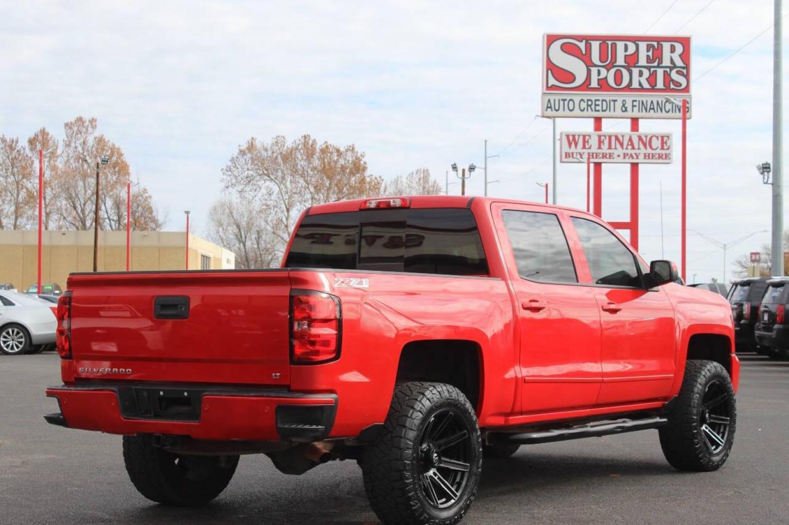 2017 Red Chevrolet Silverado 1500 LT Crew Cab 4WD (3GCUKREC9HG) with an 5.3L V8 OHV 16V engine, 6A transmission, located at 4301 NW 39th , Oklahoma City, OK, 73112, (405) 949-5600, 35.512135, -97.598671 - NO DRIVERS LICENCE NO-FULL COVERAGE INSURANCE-NO CREDIT CHECK. COME ON OVER TO SUPERSPORTS AND TAKE A LOOK AND TEST DRIVE. PLEASE GIVE US A CALL AT (405) 949-5600. NO LICENSIA DE MANEJAR- NO SEGURO DE COBERTURA TOTAL- NO VERIFICACCION DE CREDITO. POR FAVOR VENGAN A SUPERSPORTS, ECHE UN - Photo#3