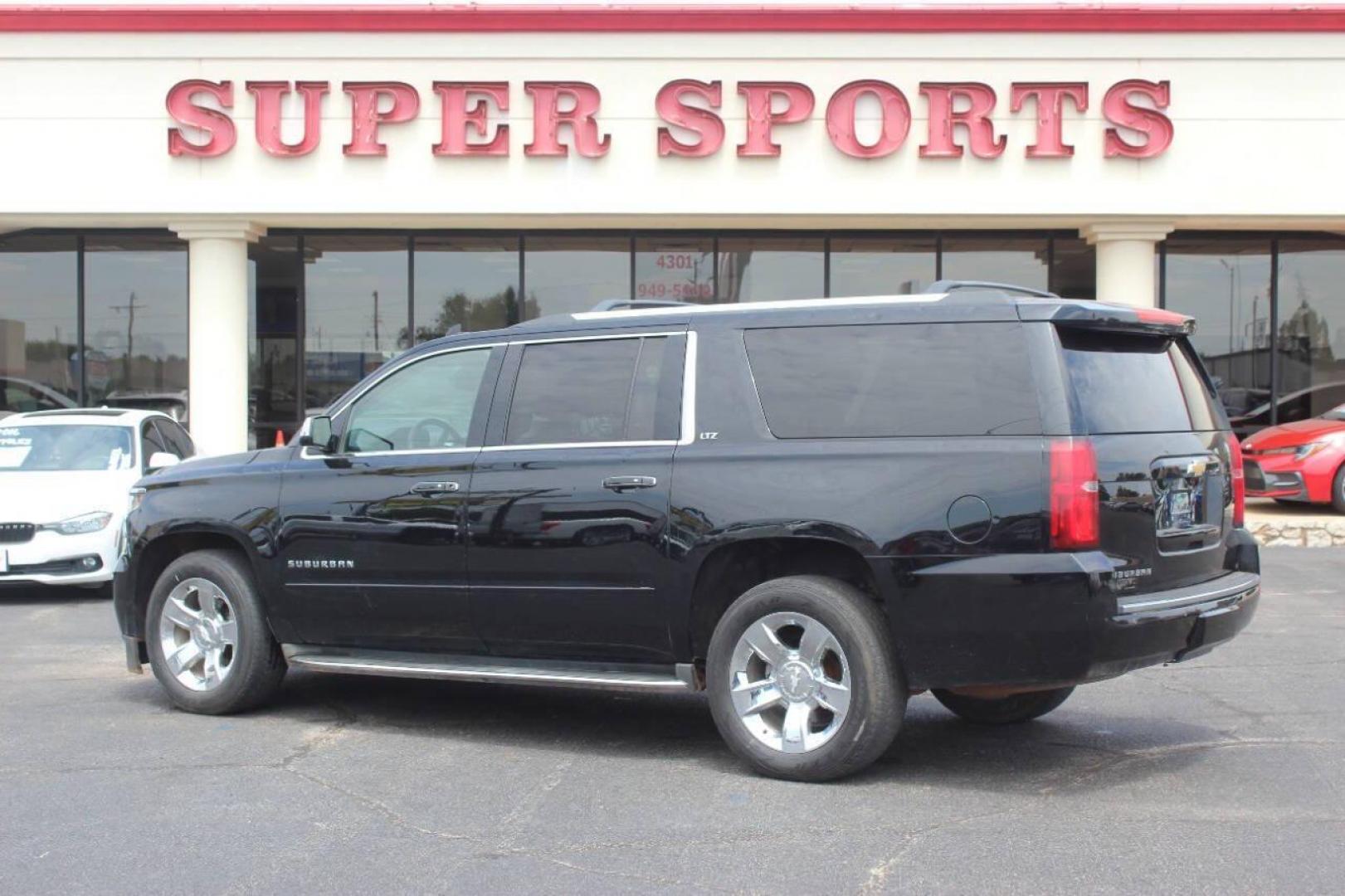 2015 Black Chevrolet Suburban LTZ 1500 4WD (1GNSKKKC3FR) with an 5.3L V8 OHV 16V engine, 6-Speed Automatic transmission, located at 4301 NW 39th , Oklahoma City, OK, 73112, (405) 949-5600, 35.512135, -97.598671 - NO DRIVERS LICENCE NO-FULL COVERAGE INSURANCE-NO CREDIT CHECK. COME ON OVER TO SUPERSPORTS AND TAKE A LOOK AND TEST DRIVE. PLEASE GIVE US A CALL AT (405) 949-5600. NO LICENSIA DE MANEJAR- NO SEGURO DE COBERTURA TOTAL- NO VERIFICACCION DE CREDITO. POR FAVOR VENGAN A SUPERSPORTS, ECHE UN - Photo#4