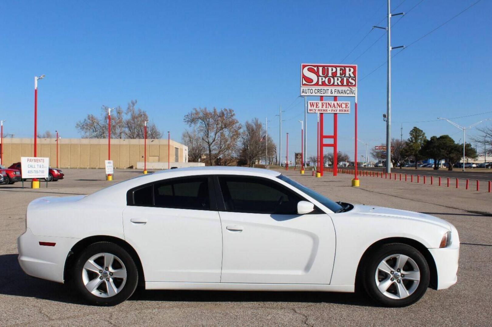 2013 White Dodge Charger SE (2C3CDXBG5DH) with an 3.6L V6 DOHC 24V engine, 5-Speed Automatic transmission, located at 4301 NW 39th , Oklahoma City, OK, 73112, (405) 949-5600, 35.512135, -97.598671 - NO DRIVERS LICENCE NO-FULL COVERAGE INSURANCE-NO CREDIT CHECK. COME ON OVER TO SUPERSPORTS AND TAKE A LOOK AND TEST DRIVE PLEASE GIVE US A CALL AT (405) 949-5600. NO LICENSIA DE MANEJAR- NO SEGURO DE COBERTURA TOTAL- NO VERIFICACCION DE CREDITO. POR FAVOR VENGAN A SUPERSPORTS, ECHE - Photo#3