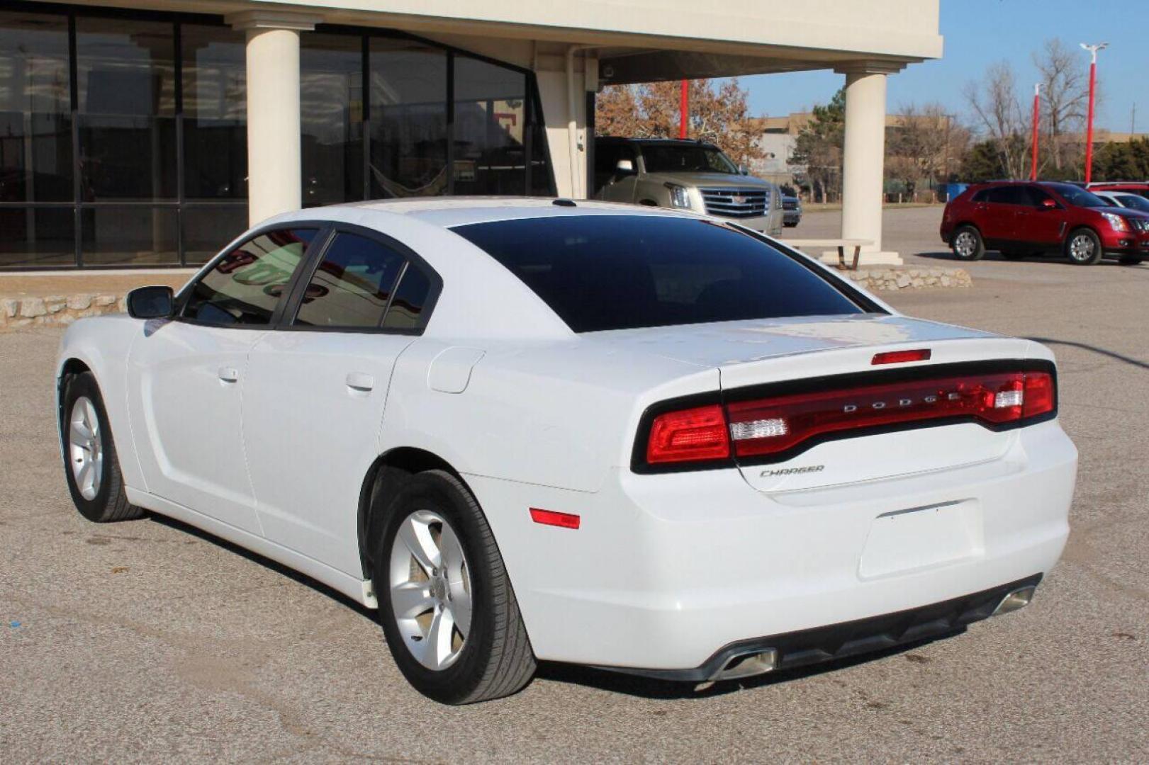 2013 White Dodge Charger SE (2C3CDXBG5DH) with an 3.6L V6 DOHC 24V engine, 5-Speed Automatic transmission, located at 4301 NW 39th , Oklahoma City, OK, 73112, (405) 949-5600, 35.512135, -97.598671 - NO DRIVERS LICENCE NO-FULL COVERAGE INSURANCE-NO CREDIT CHECK. COME ON OVER TO SUPERSPORTS AND TAKE A LOOK AND TEST DRIVE PLEASE GIVE US A CALL AT (405) 949-5600. NO LICENSIA DE MANEJAR- NO SEGURO DE COBERTURA TOTAL- NO VERIFICACCION DE CREDITO. POR FAVOR VENGAN A SUPERSPORTS, ECHE - Photo#5