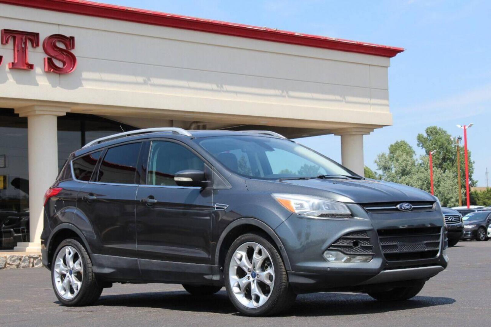 2015 Gray Ford Escape Titanium FWD (1FMCU0J97FU) with an 2.0L L4 DOHC 16V engine, 6-Speed Automatic transmission, located at 4301 NW 39th , Oklahoma City, OK, 73112, (405) 949-5600, 35.512135, -97.598671 - NO DRIVERS LICENCE NO-FULL COVERAGE INSURANCE-NO CREDIT CHECK. COME ON OVER TO SUPERSPORTS AND TAKE A LOOK AND TEST DRIVE PLEASE GIVE US A CALL AT (405) 949-5600. NO LICENSIA DE MANEJAR- NO SEGURO DE COBERTURA TOTAL- NO VERIFICACCION DE CREDITO. POR FAVOR VENGAN A SUPERSPORTS, ECHE UN V - Photo#0