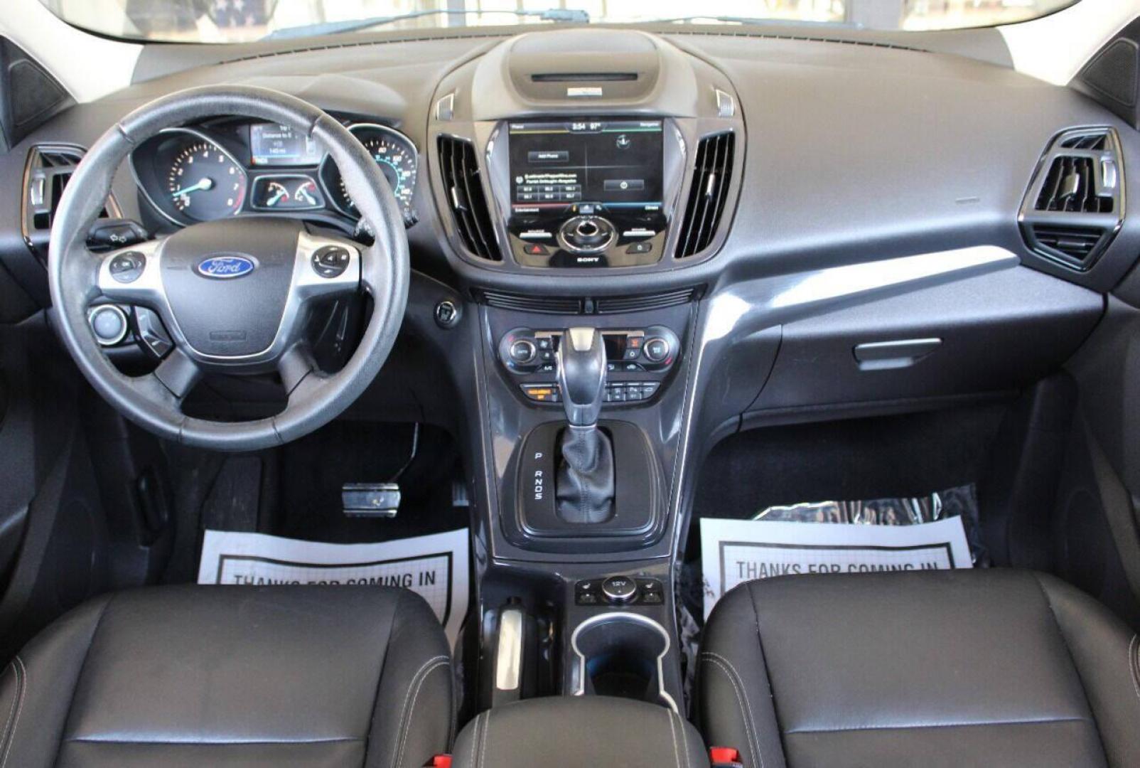 2015 Gray Ford Escape Titanium FWD (1FMCU0J97FU) with an 2.0L L4 DOHC 16V engine, 6-Speed Automatic transmission, located at 4301 NW 39th , Oklahoma City, OK, 73112, (405) 949-5600, 35.512135, -97.598671 - NO DRIVERS LICENCE NO-FULL COVERAGE INSURANCE-NO CREDIT CHECK. COME ON OVER TO SUPERSPORTS AND TAKE A LOOK AND TEST DRIVE PLEASE GIVE US A CALL AT (405) 949-5600. NO LICENSIA DE MANEJAR- NO SEGURO DE COBERTURA TOTAL- NO VERIFICACCION DE CREDITO. POR FAVOR VENGAN A SUPERSPORTS, ECHE UN V - Photo#17