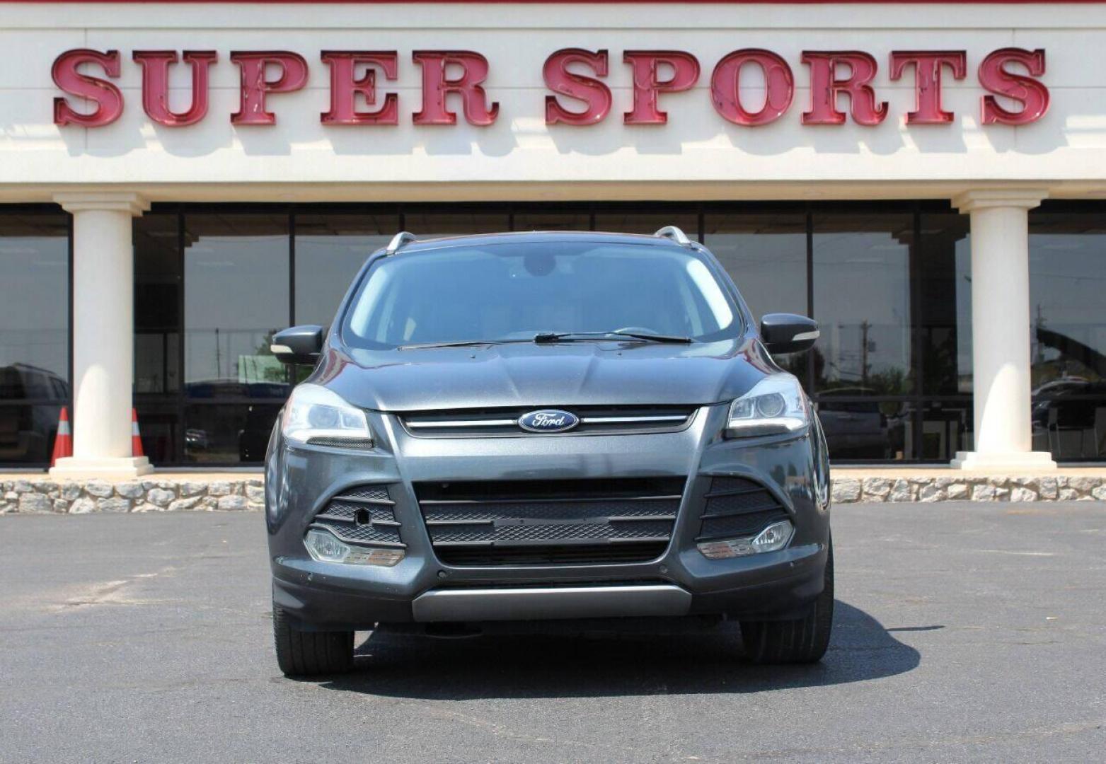 2015 Gray Ford Escape Titanium FWD (1FMCU0J97FU) with an 2.0L L4 DOHC 16V engine, 6-Speed Automatic transmission, located at 4301 NW 39th , Oklahoma City, OK, 73112, (405) 949-5600, 35.512135, -97.598671 - NO DRIVERS LICENCE NO-FULL COVERAGE INSURANCE-NO CREDIT CHECK. COME ON OVER TO SUPERSPORTS AND TAKE A LOOK AND TEST DRIVE PLEASE GIVE US A CALL AT (405) 949-5600. NO LICENSIA DE MANEJAR- NO SEGURO DE COBERTURA TOTAL- NO VERIFICACCION DE CREDITO. POR FAVOR VENGAN A SUPERSPORTS, ECHE UN V - Photo#2