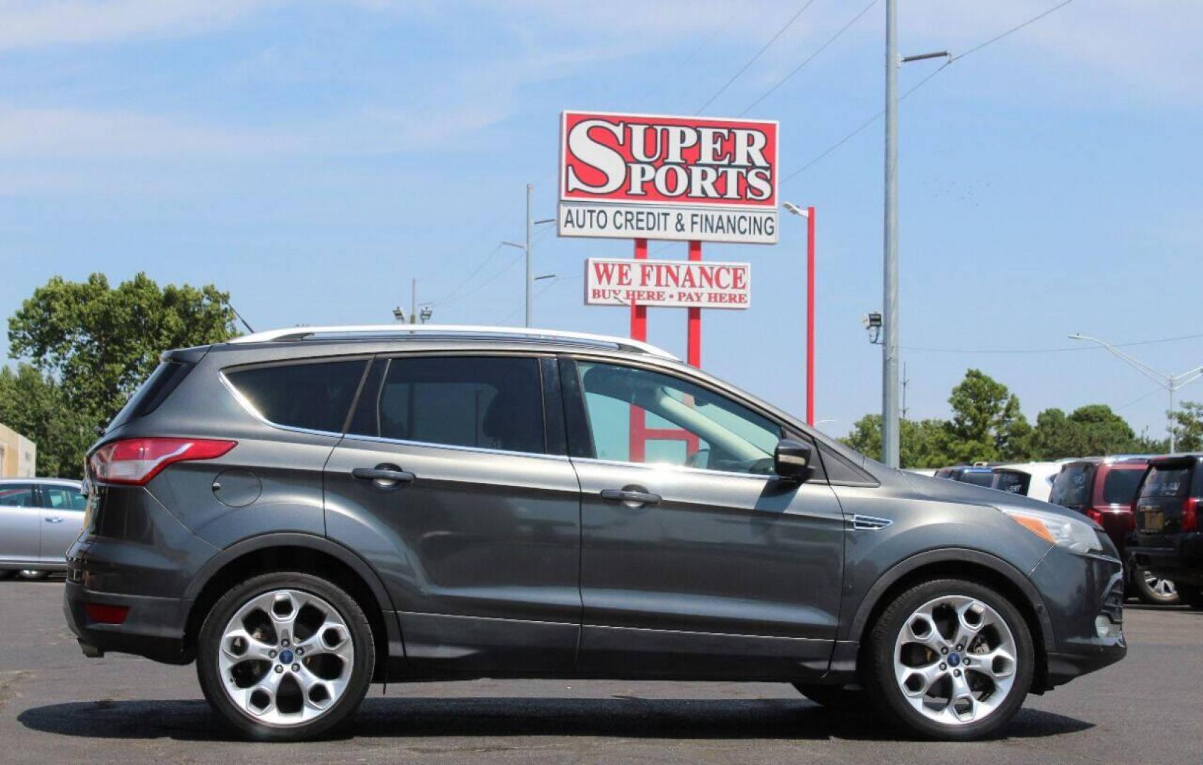 2015 Gray Ford Escape Titanium FWD (1FMCU0J97FU) with an 2.0L L4 DOHC 16V engine, 6-Speed Automatic transmission, located at 4301 NW 39th , Oklahoma City, OK, 73112, (405) 949-5600, 35.512135, -97.598671 - NO DRIVERS LICENCE NO-FULL COVERAGE INSURANCE-NO CREDIT CHECK. COME ON OVER TO SUPERSPORTS AND TAKE A LOOK AND TEST DRIVE PLEASE GIVE US A CALL AT (405) 949-5600. NO LICENSIA DE MANEJAR- NO SEGURO DE COBERTURA TOTAL- NO VERIFICACCION DE CREDITO. POR FAVOR VENGAN A SUPERSPORTS, ECHE UN V - Photo#3