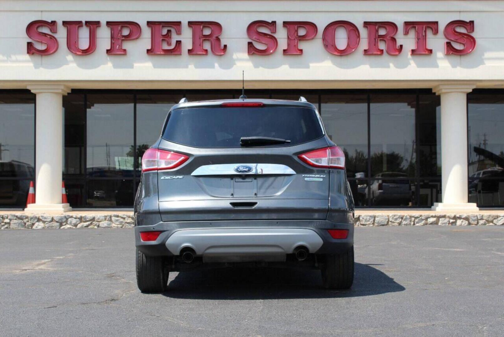 2015 Gray Ford Escape Titanium FWD (1FMCU0J97FU) with an 2.0L L4 DOHC 16V engine, 6-Speed Automatic transmission, located at 4301 NW 39th , Oklahoma City, OK, 73112, (405) 949-5600, 35.512135, -97.598671 - NO DRIVERS LICENCE NO-FULL COVERAGE INSURANCE-NO CREDIT CHECK. COME ON OVER TO SUPERSPORTS AND TAKE A LOOK AND TEST DRIVE PLEASE GIVE US A CALL AT (405) 949-5600. NO LICENSIA DE MANEJAR- NO SEGURO DE COBERTURA TOTAL- NO VERIFICACCION DE CREDITO. POR FAVOR VENGAN A SUPERSPORTS, ECHE UN V - Photo#4