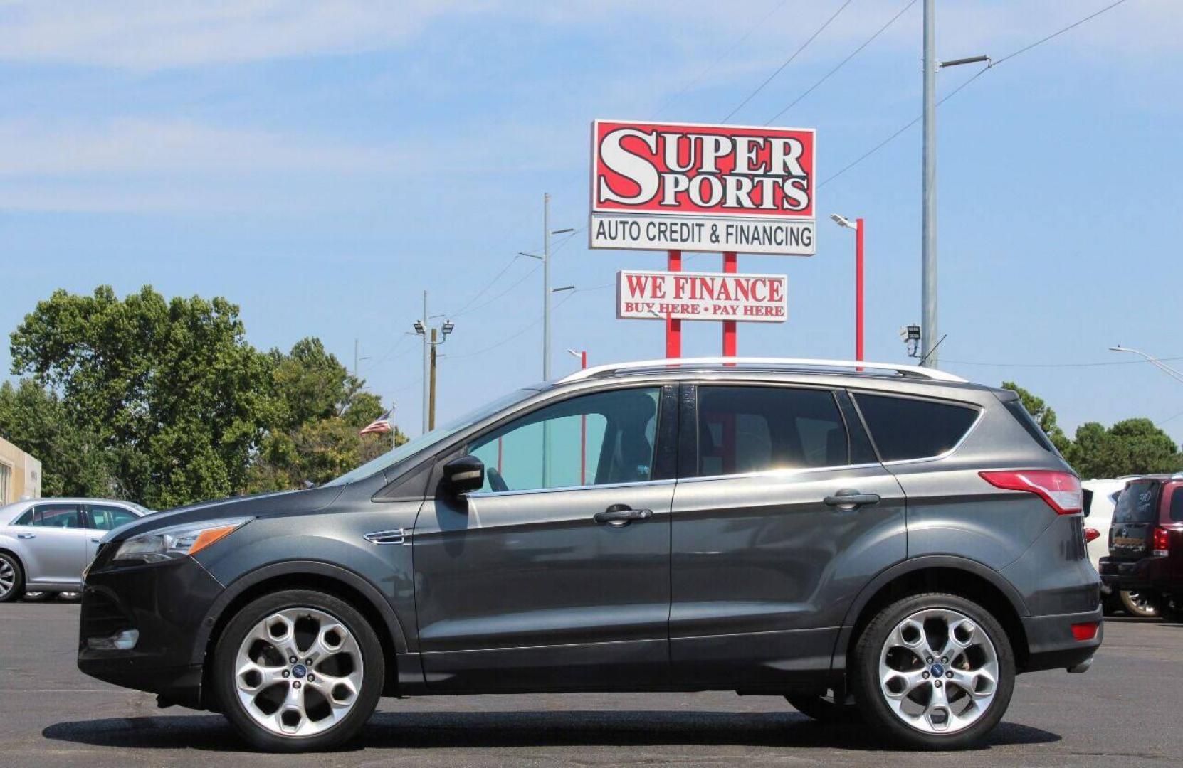 2015 Gray Ford Escape Titanium FWD (1FMCU0J97FU) with an 2.0L L4 DOHC 16V engine, 6-Speed Automatic transmission, located at 4301 NW 39th , Oklahoma City, OK, 73112, (405) 949-5600, 35.512135, -97.598671 - NO DRIVERS LICENCE NO-FULL COVERAGE INSURANCE-NO CREDIT CHECK. COME ON OVER TO SUPERSPORTS AND TAKE A LOOK AND TEST DRIVE PLEASE GIVE US A CALL AT (405) 949-5600. NO LICENSIA DE MANEJAR- NO SEGURO DE COBERTURA TOTAL- NO VERIFICACCION DE CREDITO. POR FAVOR VENGAN A SUPERSPORTS, ECHE UN V - Photo#6