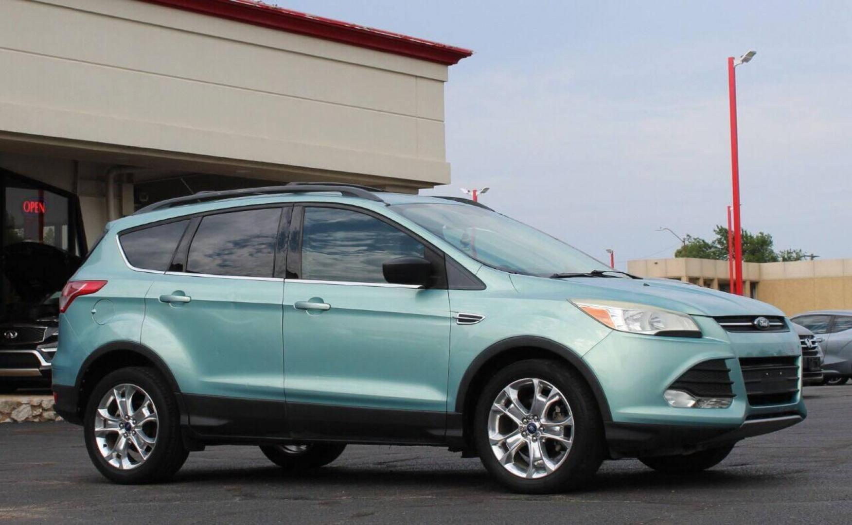 2013 Teal Ford Escape (1FMCU0GX7DU) with an 1.6L I4 Turbocharger 1.6L I4 engine, Automatic 6-Speed transmission, located at 4301 NW 39th , Oklahoma City, OK, 73112, (405) 949-5600, 35.512135, -97.598671 - NO DRIVERS LICENCE NO-FULL COVERAGE INSURANCE-NO CREDIT CHECK. COME ON OVER TO SUPERSPORTS AND TAKE A LOOK AND TEST DRIVE PLEASE GIVE US A CALL AT (405) 949-5600. NO LICENSIA DE MANEJAR- NO SEGURO DE COBERTURA TOTAL- NO VERIFICACCION DE CREDITO. POR FAVOR VENGAN A SUPERSPORTS, ECHE UN VISTAZO Y - Photo#2