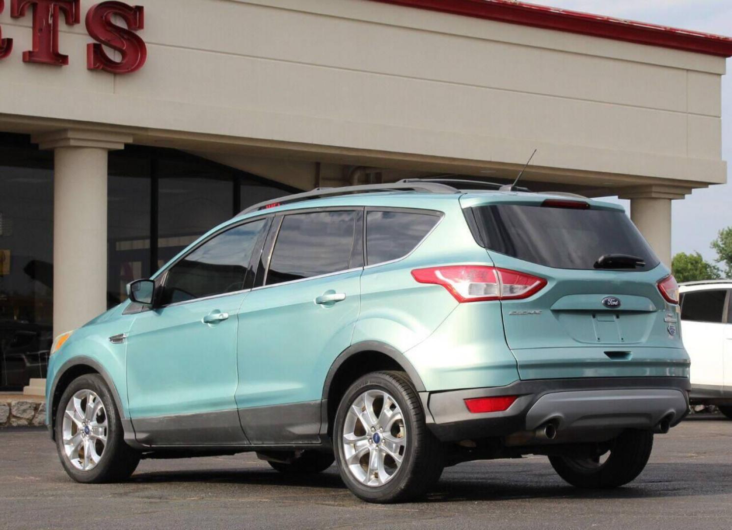 2013 Teal Ford Escape (1FMCU0GX7DU) with an 1.6L I4 Turbocharger 1.6L I4 engine, Automatic 6-Speed transmission, located at 4301 NW 39th , Oklahoma City, OK, 73112, (405) 949-5600, 35.512135, -97.598671 - NO DRIVERS LICENCE NO-FULL COVERAGE INSURANCE-NO CREDIT CHECK. COME ON OVER TO SUPERSPORTS AND TAKE A LOOK AND TEST DRIVE PLEASE GIVE US A CALL AT (405) 949-5600. NO LICENSIA DE MANEJAR- NO SEGURO DE COBERTURA TOTAL- NO VERIFICACCION DE CREDITO. POR FAVOR VENGAN A SUPERSPORTS, ECHE UN VISTAZO Y - Photo#5