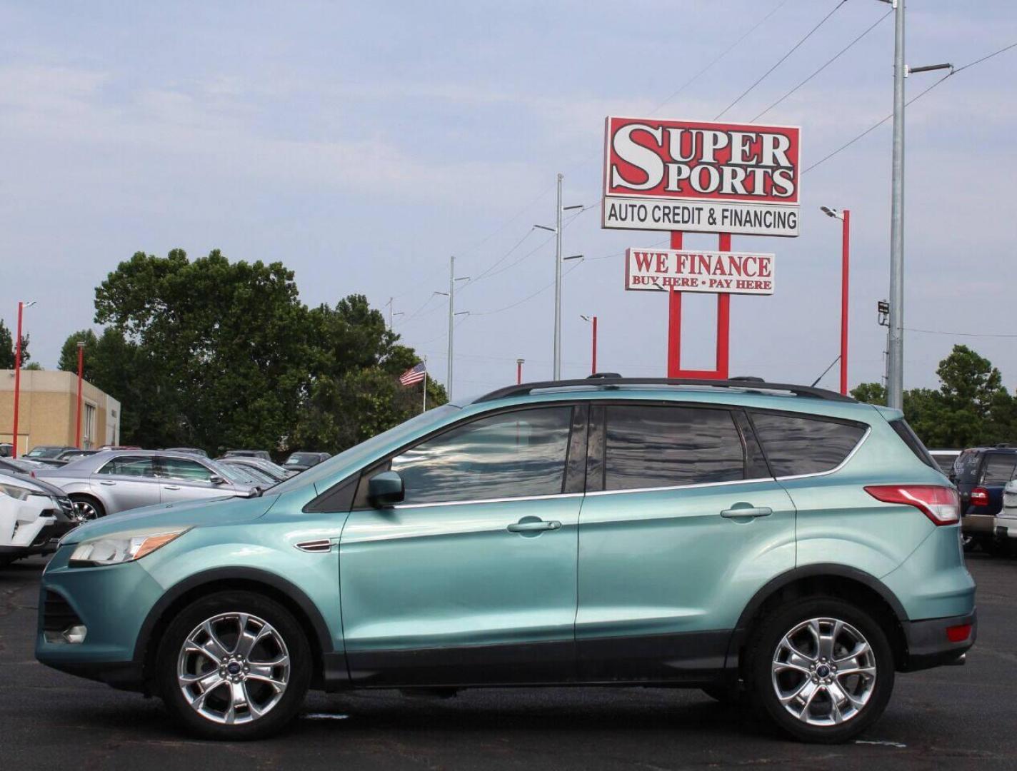 2013 Teal Ford Escape (1FMCU0GX7DU) with an 1.6L I4 Turbocharger 1.6L I4 engine, Automatic 6-Speed transmission, located at 4301 NW 39th , Oklahoma City, OK, 73112, (405) 949-5600, 35.512135, -97.598671 - NO DRIVERS LICENCE NO-FULL COVERAGE INSURANCE-NO CREDIT CHECK. COME ON OVER TO SUPERSPORTS AND TAKE A LOOK AND TEST DRIVE PLEASE GIVE US A CALL AT (405) 949-5600. NO LICENSIA DE MANEJAR- NO SEGURO DE COBERTURA TOTAL- NO VERIFICACCION DE CREDITO. POR FAVOR VENGAN A SUPERSPORTS, ECHE UN VISTAZO Y - Photo#6