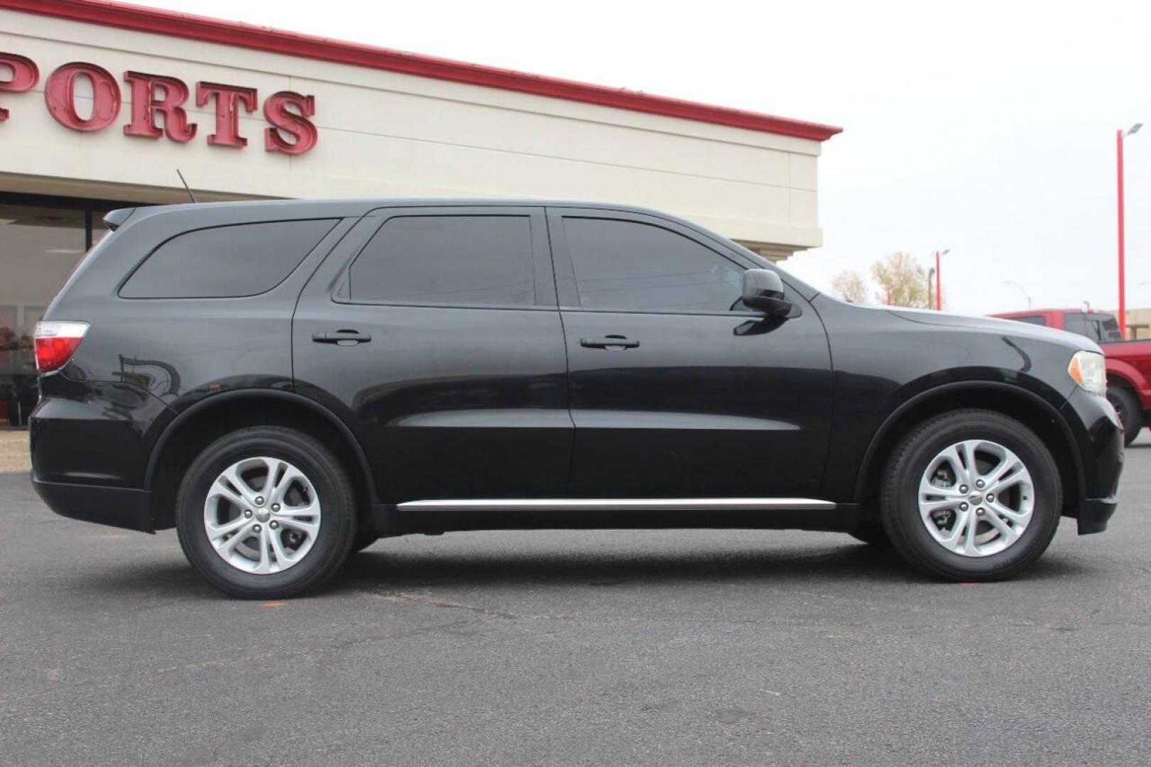 2013 Black Dodge Durango SXT RWD (1C4RDHAG7DC) with an 3.6L V6 DOHC 24V engine, 5-Speed Automatic transmission, located at 4301 NW 39th , Oklahoma City, OK, 73112, (405) 949-5600, 35.512135, -97.598671 - NO DRIVERS LICENCE NO-FULL COVERAGE INSURANCE-NO CREDIT CHECK. COME ON OVER TO SUPERSPORTS AND TAKE A LOOK AND TEST DRIVE PLEASE GIVE US A CALL AT (405) 949-5600. NO LICENSIA DE MANEJAR- NO SEGURO DE COBERTURA TOTAL- NO VERIFICACCION DE CREDITO. POR FAVOR VENGAN A SUPERSPORTS, E - Photo#1