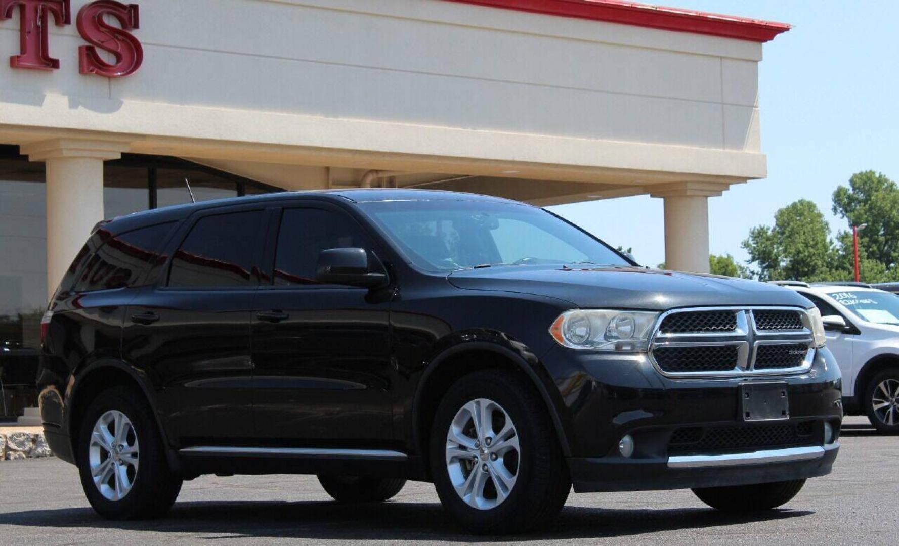 2013 Black Dodge Durango SXT RWD (1C4RDHAG7DC) with an 3.6L V6 DOHC 24V engine, 5-Speed Automatic transmission, located at 4301 NW 39th , Oklahoma City, OK, 73112, (405) 949-5600, 35.512135, -97.598671 - NO DRIVERS LICENCE NO-FULL COVERAGE INSURANCE-NO CREDIT CHECK. COME ON OVER TO SUPERSPORTS AND TAKE A LOOK AND TEST DRIVE PLEASE GIVE US A CALL AT (405) 949-5600. NO LICENSIA DE MANEJAR- NO SEGURO DE COBERTURA TOTAL- NO VERIFICACCION DE CREDITO. POR FAVOR VENGAN A SUPERSPORTS, E - Photo#2