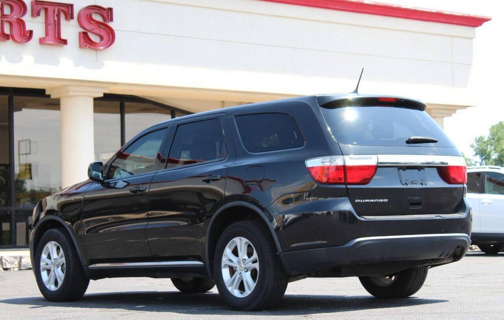 2013 Black Dodge Durango SXT RWD (1C4RDHAG7DC) with an 3.6L V6 DOHC 24V engine, 5-Speed Automatic transmission, located at 4301 NW 39th , Oklahoma City, OK, 73112, (405) 949-5600, 35.512135, -97.598671 - NO DRIVERS LICENCE NO-FULL COVERAGE INSURANCE-NO CREDIT CHECK. COME ON OVER TO SUPERSPORTS AND TAKE A LOOK AND TEST DRIVE PLEASE GIVE US A CALL AT (405) 949-5600. NO LICENSIA DE MANEJAR- NO SEGURO DE COBERTURA TOTAL- NO VERIFICACCION DE CREDITO. POR FAVOR VENGAN A SUPERSPORTS, E - Photo#5