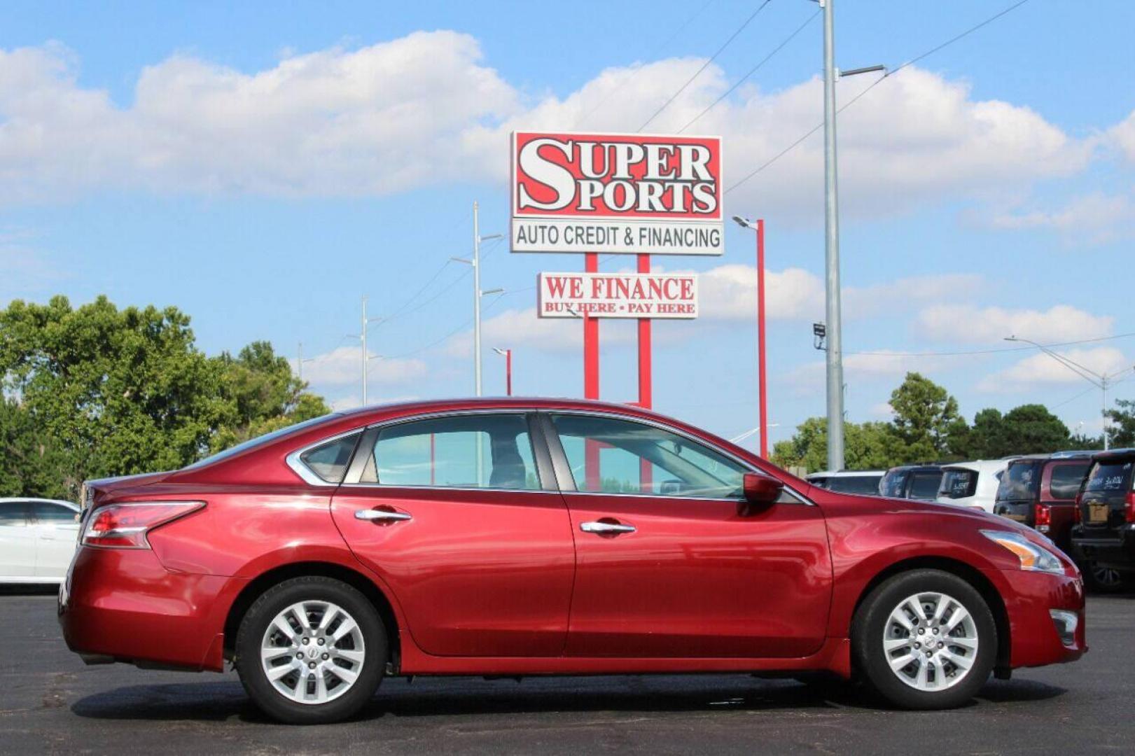 2015 Red Nissan Altima 2.5 S (1N4AL3AP7FC) with an 2.5L L4 DOHC 16V engine, Continuously Variable Transmission transmission, located at 4301 NW 39th , Oklahoma City, OK, 73112, (405) 949-5600, 35.512135, -97.598671 - NO DRIVERS LICENCE NO-FULL COVERAGE INSURANCE-NO CREDIT CHECK. COME ON OVER TO SUPERSPORTS AND TAKE A LOOK AND TEST DRIVE. PLEASE GIVE US A CALL AT (405) 949-5600. NO LICENSIA DE MANEJAR- NO SEGURO DE COBERTURA TOTAL- NO VERIFICACCION DE CREDITO. POR FAVOR VENGAN A SUPERSPORTS, - Photo#3