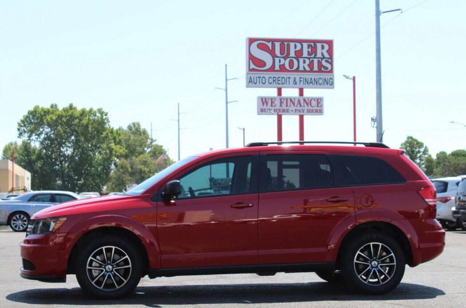 2018 Red Dodge Journey SE (3C4PDCAB3JT) with an 2.4L L4 DOHC 16V engine, 4A transmission, located at 4301 NW 39th , Oklahoma City, OK, 73112, (405) 949-5600, 35.512135, -97.598671 - NO DRIVERS LICENCE NO-FULL COVERAGE INSURANCE-NO CREDIT CHECK. COME ON OVER TO SUPERSPORTS AND TAKE A LOOK AND TEST DRIVE. PLEASE GIVE US A CALL AT (405) 949-5600. NO LICENSIA DE MANEJAR - NO SEGURO DE COBERTURA TOTAL - NO VERIFICACION DE CREDITO. POR FAVOR VENGAN A SUPERSPORTS, ECHE UN - Photo#6