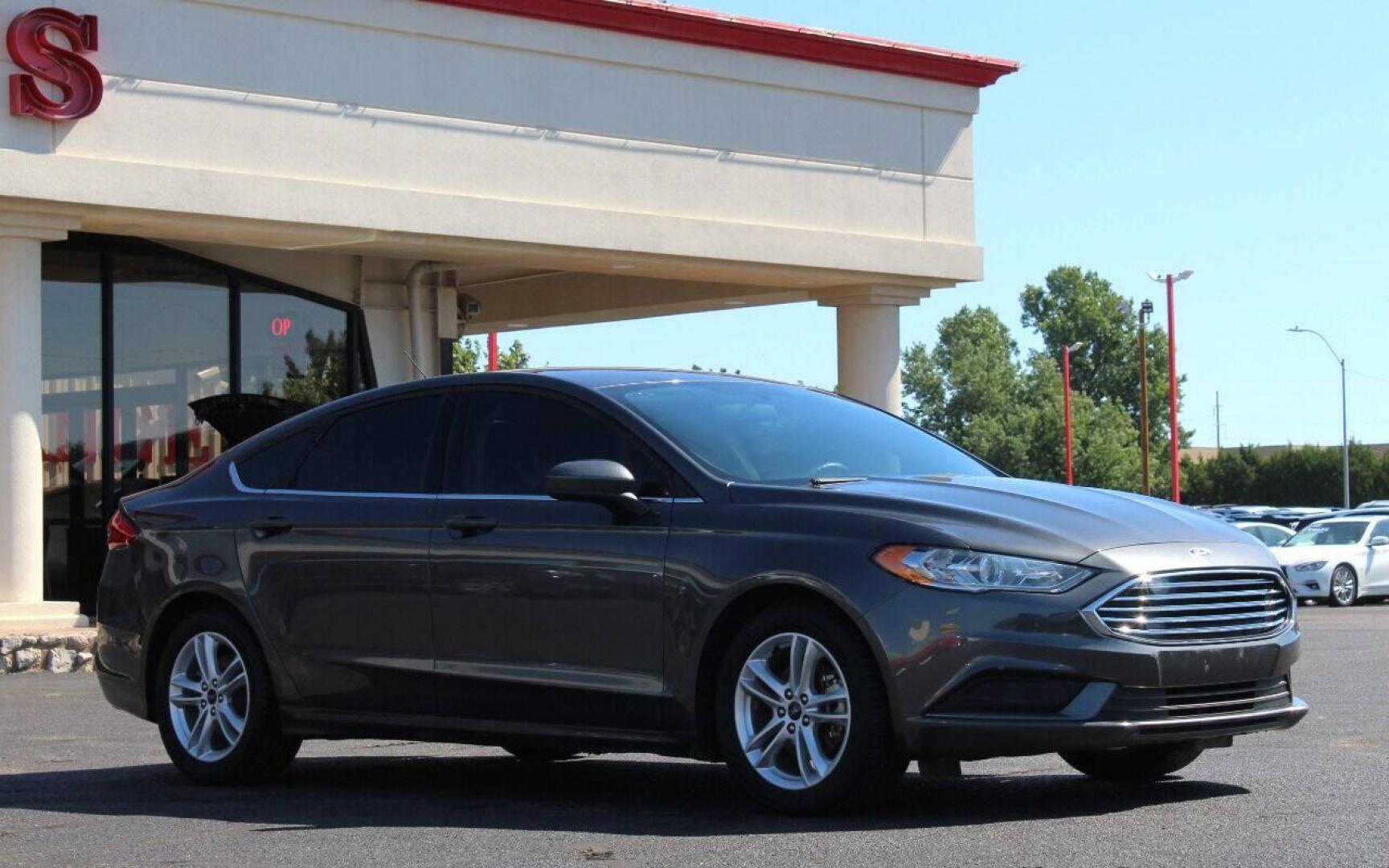 2018 Gray Ford Fusion SE (3FA6P0HD6JR) with an 1.5L L4 DOHC 16V engine, 6A transmission, located at 4301 NW 39th , Oklahoma City, OK, 73112, (405) 949-5600, 35.512135, -97.598671 - NO DRIVERS LICENCE NO - FULL COVERAGE INSURANCE - NO CREDIT CHECK. COME ON OVER TO SUPERSPORTS AND TAKE A LOOK AND TEST DRIVE. PLEASE GIVE US A CALL AT (405) 949-5600. NO LICENCIA DE MANEJAR - NO SEGURO DE COBERTURA TOTAL - NO VERIFICACION DE CREDITO. POR FAVOR VENGAN A SUPERSPORTS, ECH - Photo#0