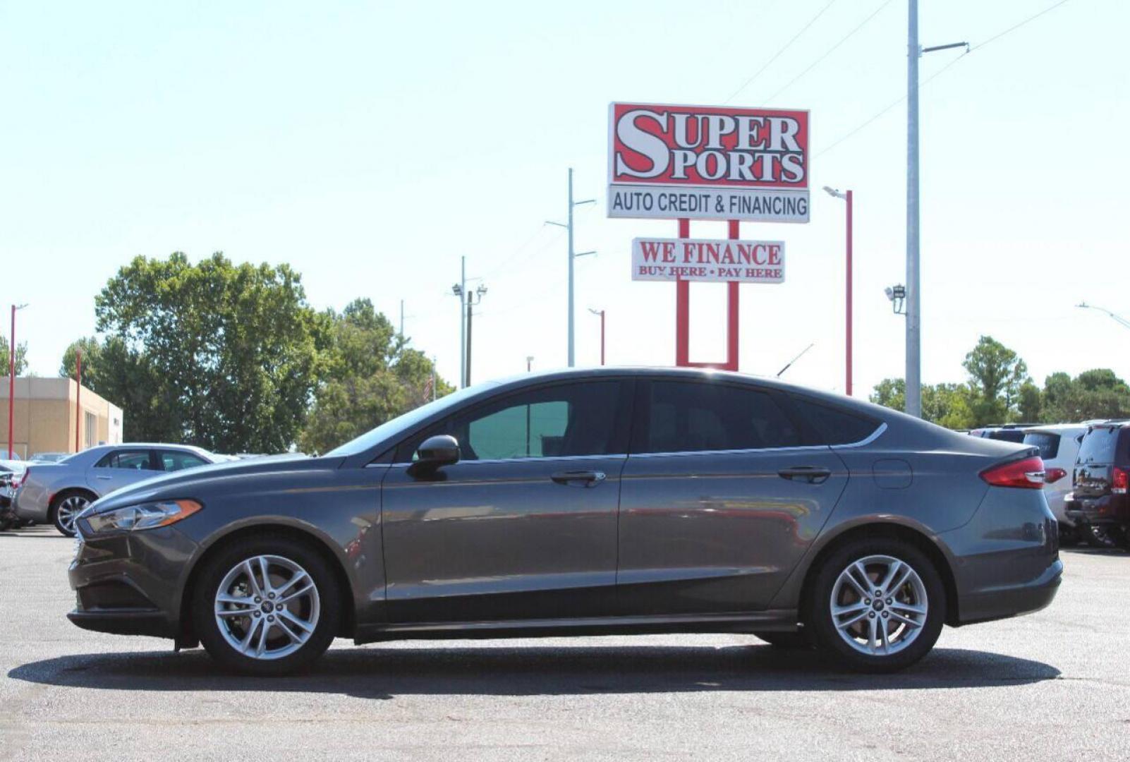 2018 Gray Ford Fusion SE (3FA6P0HD6JR) with an 1.5L L4 DOHC 16V engine, 6A transmission, located at 4301 NW 39th , Oklahoma City, OK, 73112, (405) 949-5600, 35.512135, -97.598671 - NO DRIVERS LICENCE NO - FULL COVERAGE INSURANCE - NO CREDIT CHECK. COME ON OVER TO SUPERSPORTS AND TAKE A LOOK AND TEST DRIVE. PLEASE GIVE US A CALL AT (405) 949-5600. NO LICENCIA DE MANEJAR - NO SEGURO DE COBERTURA TOTAL - NO VERIFICACION DE CREDITO. POR FAVOR VENGAN A SUPERSPORTS, ECH - Photo#6