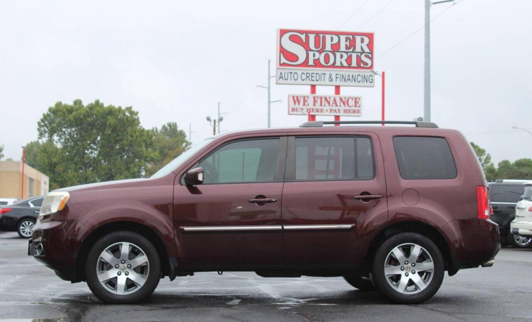 2014 Maroon Honda Pilot Touring 4WD 5-Spd AT with DVD (5FNYF4H99EB) with an 3.5L V6 SOHC 24V engine, 5-Speed Automatic transmission, located at 4301 NW 39th , Oklahoma City, OK, 73112, (405) 949-5600, 35.512135, -97.598671 - NO DRIVERS LICENSE - NO FULL COVERAGE INSURANCE - NO CREDIT CHECK. COME ON OVER TO SUPERSPORTS AND TAKE A LOOK AND TEST DRIVE. PLEASE GIVE US A CALL AT (405) 949-5600. NO LICENCIA DE MANEJAR - NO SEGURO DE COBERTURA TOTAL - NO VERIFICACION DE CREDITO. POR FAVOR VENGAN A SUPERSPORTS, E - Photo#6