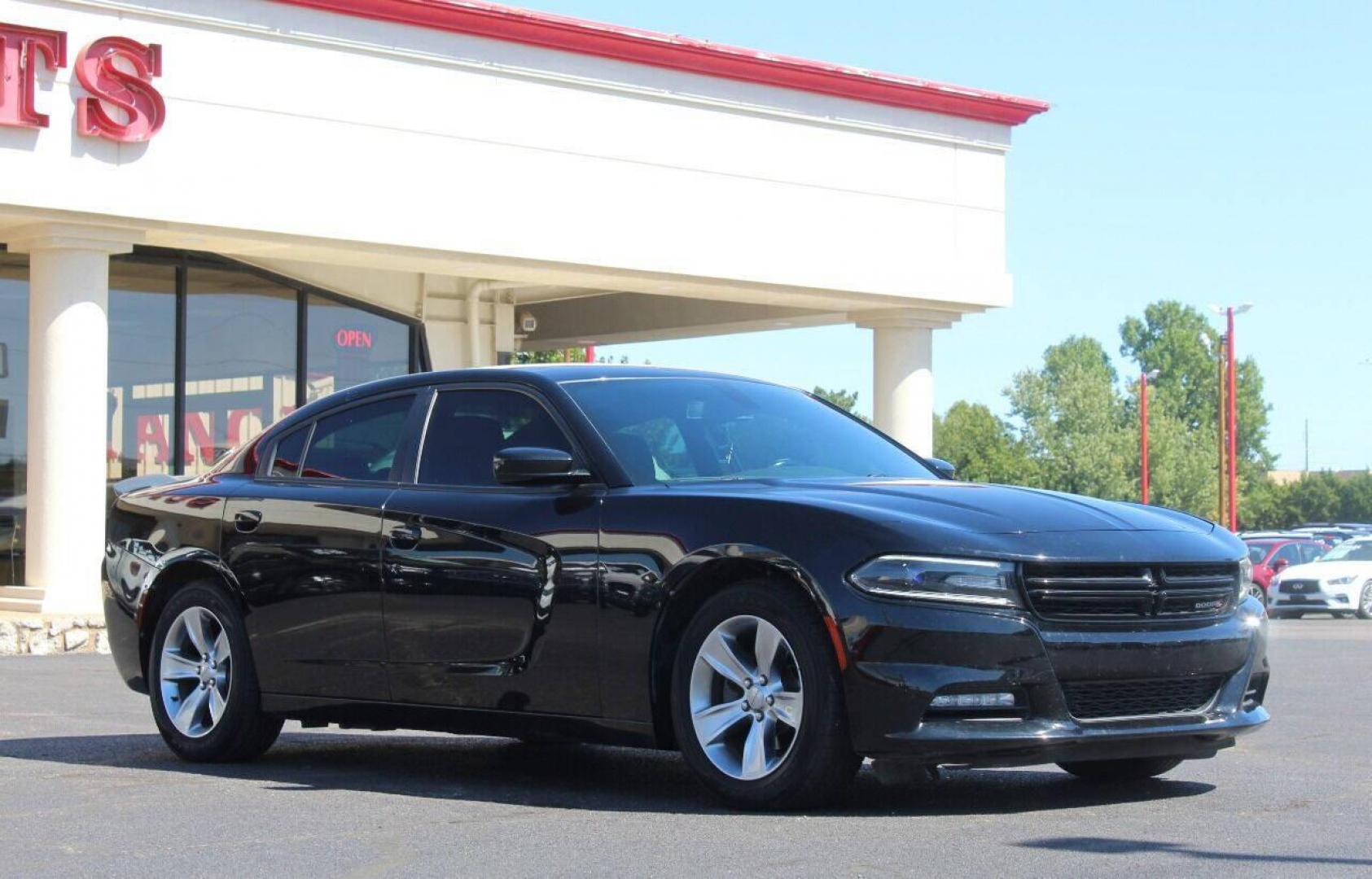 2018 Black Dodge Charger SXT (2C3CDXHG3JH) with an 3.6L V6 DOHC 24V engine, 8A transmission, located at 4301 NW 39th , Oklahoma City, OK, 73112, (405) 949-5600, 35.512135, -97.598671 - Photo#0