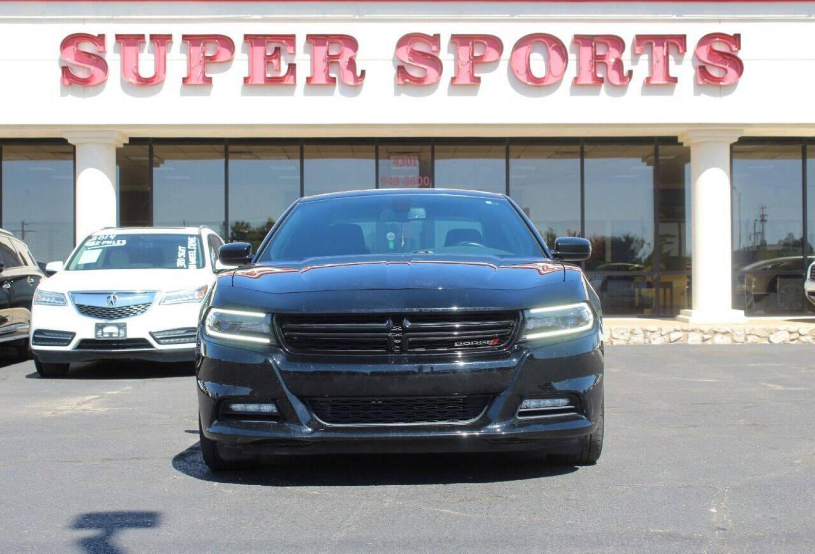 2018 Black Dodge Charger SXT (2C3CDXHG3JH) with an 3.6L V6 DOHC 24V engine, 8A transmission, located at 4301 NW 39th , Oklahoma City, OK, 73112, (405) 949-5600, 35.512135, -97.598671 - Photo#2