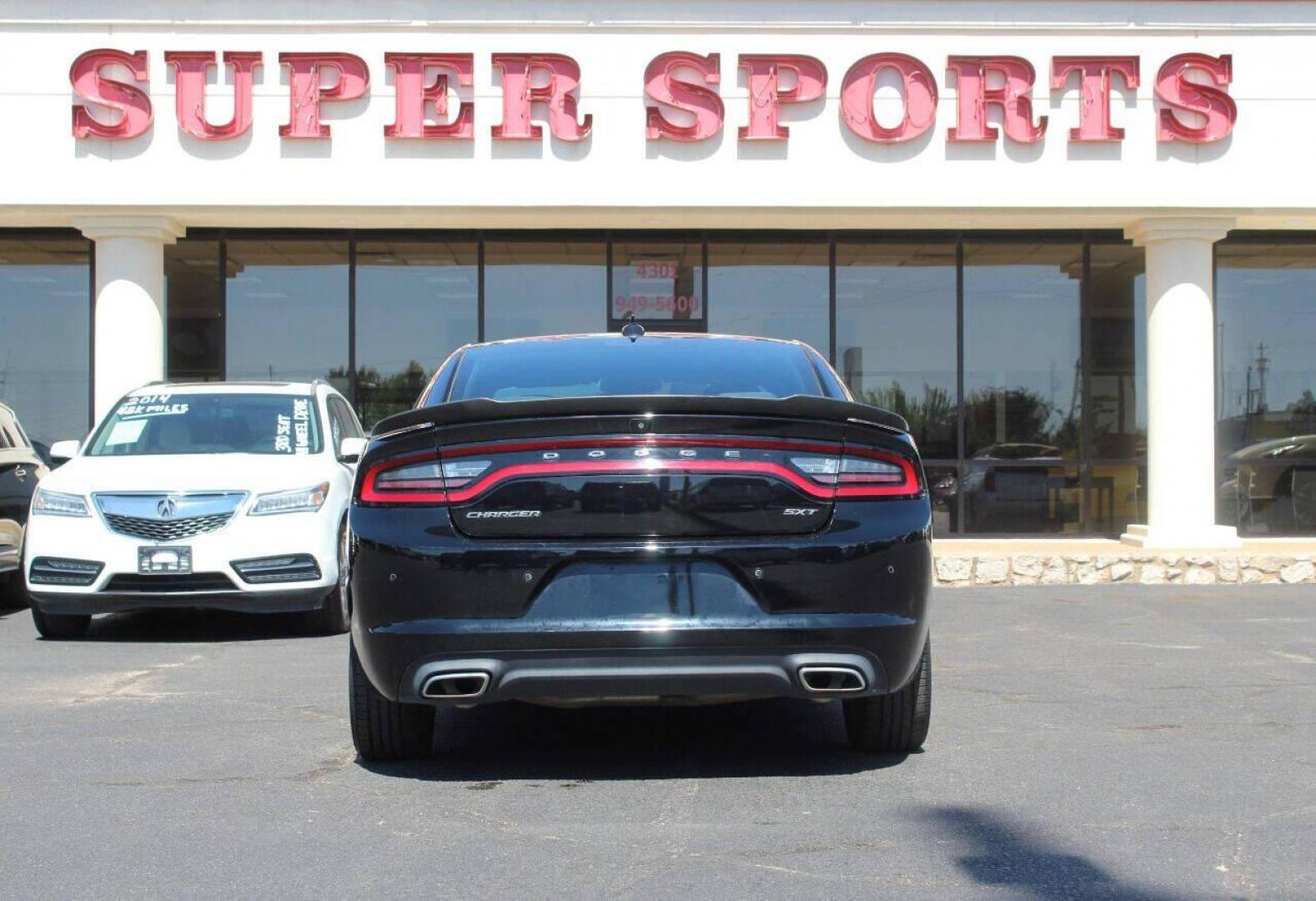 2018 Black Dodge Charger SXT (2C3CDXHG3JH) with an 3.6L V6 DOHC 24V engine, 8A transmission, located at 4301 NW 39th , Oklahoma City, OK, 73112, (405) 949-5600, 35.512135, -97.598671 - Photo#4