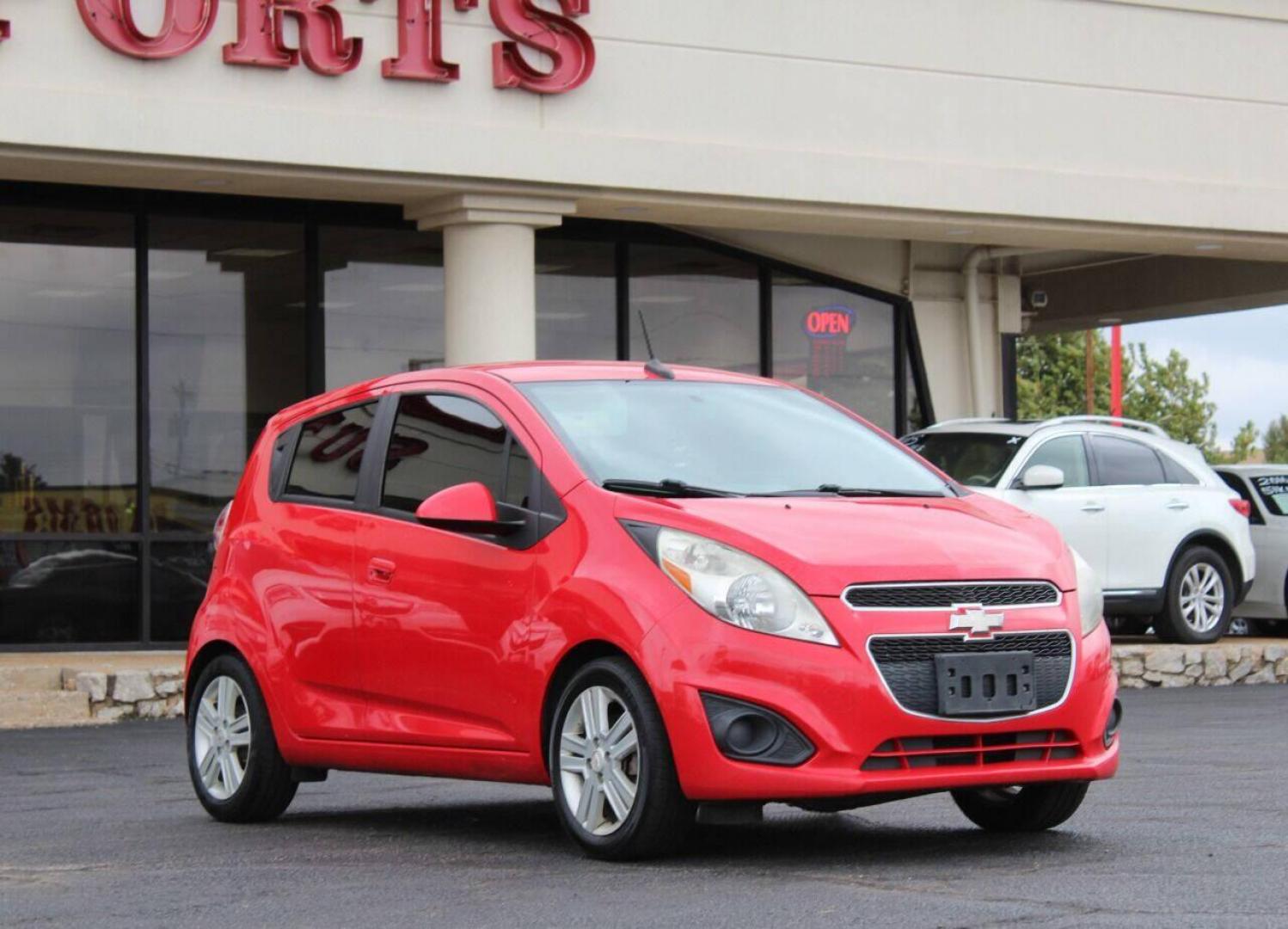 2013 Red Chevrolet Spark LS Manual (KL8CA6S95DC) with an 1.2L L4 16V DOHC engine, 5-Speed Manual transmission, located at 4301 NW 39th , Oklahoma City, OK, 73112, (405) 949-5600, 35.512135, -97.598671 - Photo#0