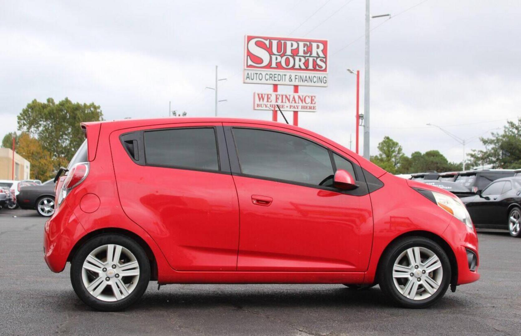 2013 Red Chevrolet Spark LS Manual (KL8CA6S95DC) with an 1.2L L4 16V DOHC engine, 5-Speed Manual transmission, located at 4301 NW 39th , Oklahoma City, OK, 73112, (405) 949-5600, 35.512135, -97.598671 - Photo#3