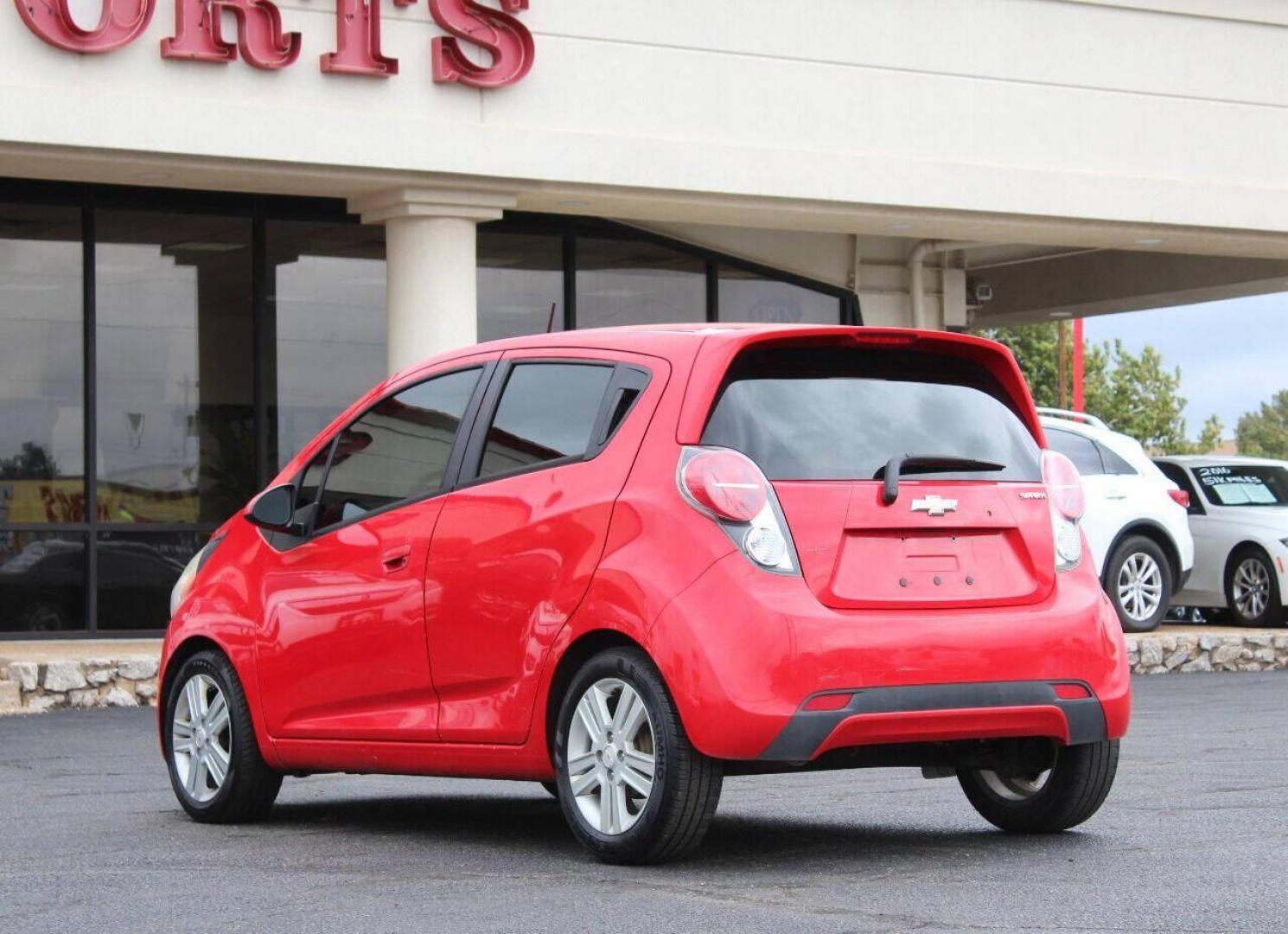 2013 Red Chevrolet Spark LS Manual (KL8CA6S95DC) with an 1.2L L4 16V DOHC engine, 5-Speed Manual transmission, located at 4301 NW 39th , Oklahoma City, OK, 73112, (405) 949-5600, 35.512135, -97.598671 - Photo#5