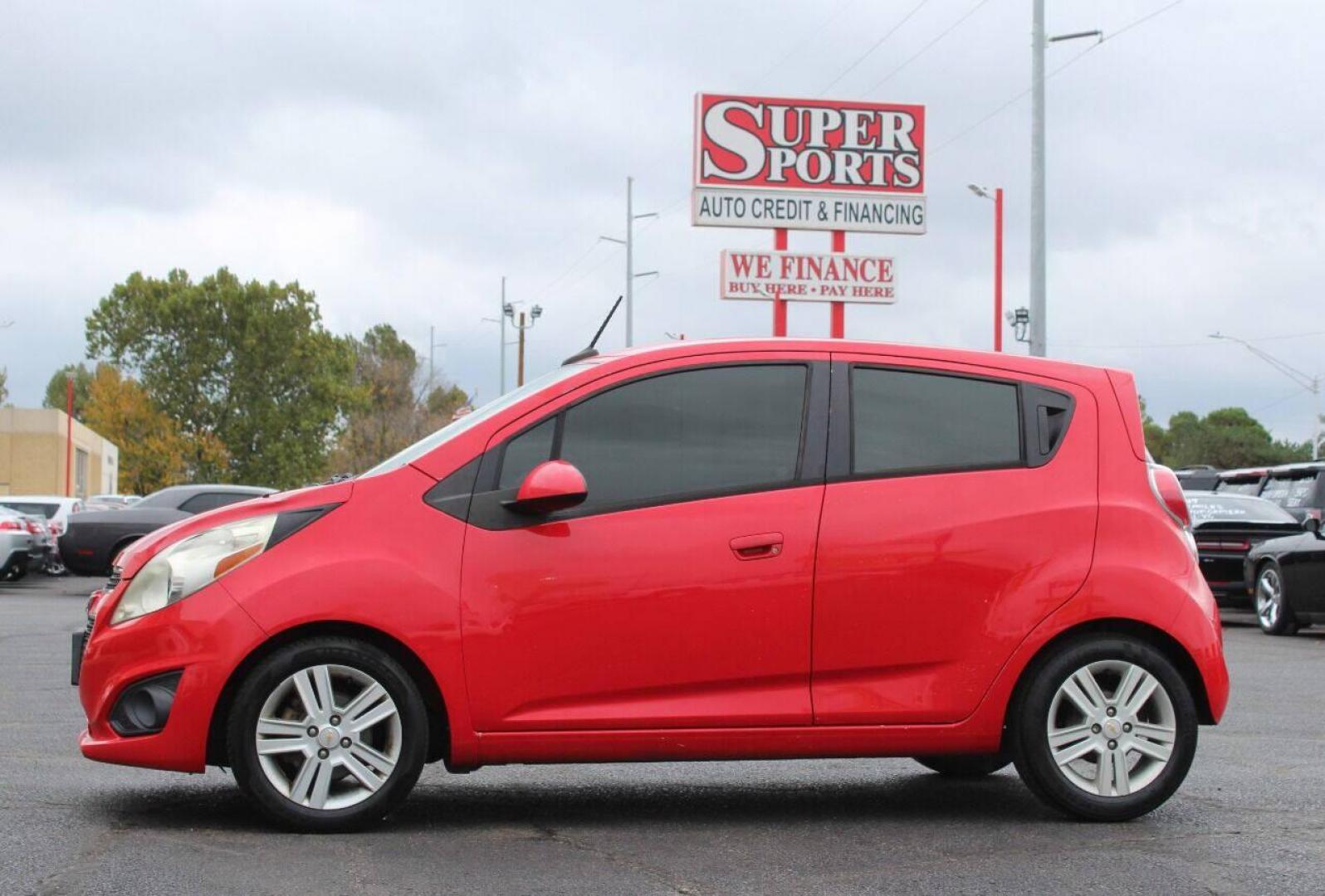 2013 Red Chevrolet Spark LS Manual (KL8CA6S95DC) with an 1.2L L4 16V DOHC engine, 5-Speed Manual transmission, located at 4301 NW 39th , Oklahoma City, OK, 73112, (405) 949-5600, 35.512135, -97.598671 - Photo#6