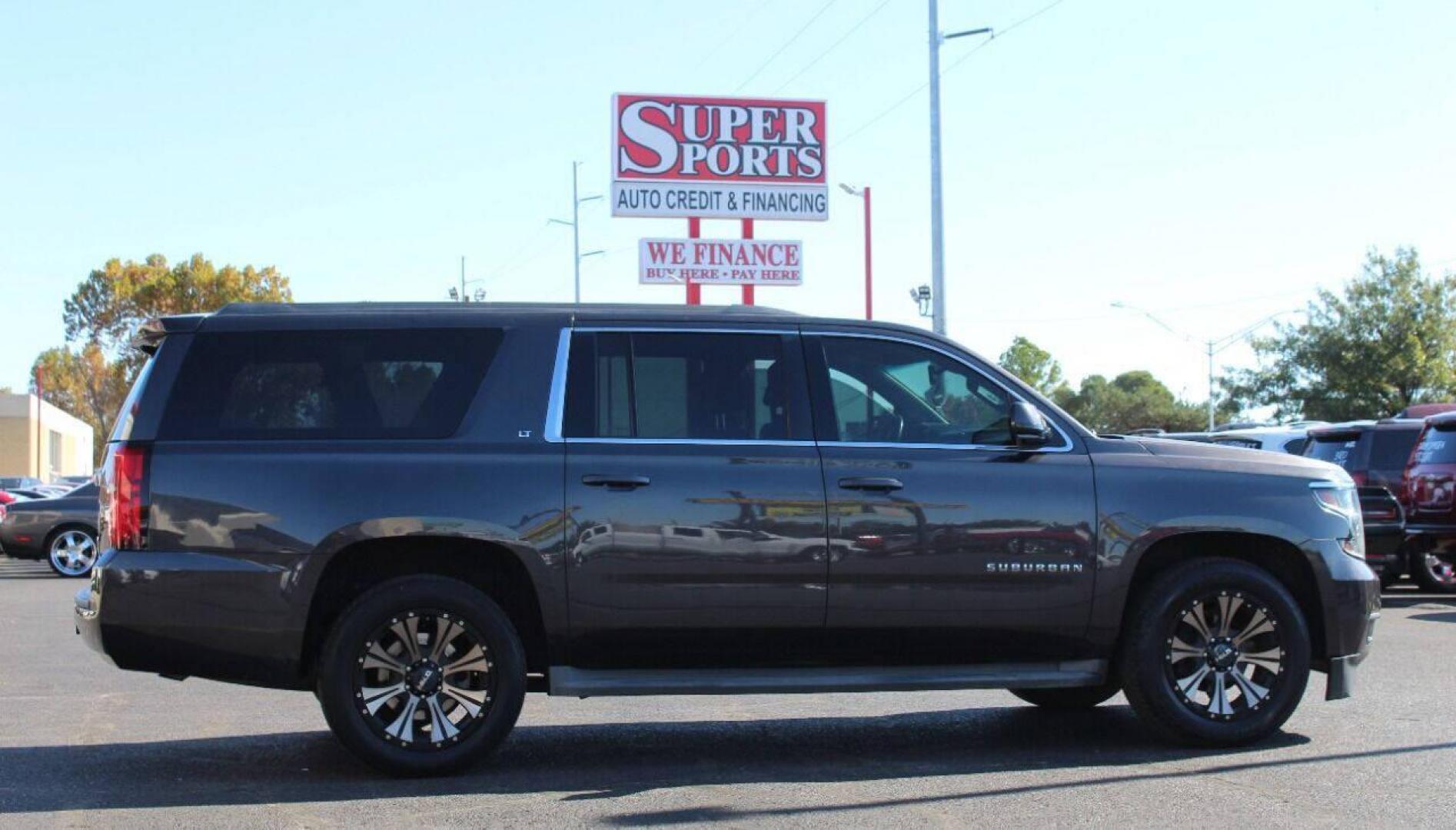 2015 Black Chevrolet Suburban LT 1500 2WD (1GNSCJKC8FR) with an 5.3L V8 OHV 16V engine, 6-Speed Automatic transmission, located at 4301 NW 39th , Oklahoma City, OK, 73112, (405) 949-5600, 35.512135, -97.598671 - NO DRIVERS LICENCE - NO FULL COVERAGE INSURANCE - NO CREDIT CHECK. COME ON OVER TO SUPERSPORTS AND TAKE A LOOK AND TEST DRIVE. PLEASE GIVE US A CALL AT (405) 949-5600. NO LICENCIA DE MANEJAR - NO SEGURO DE COBERTURA TOTAL - NO VERIFICACION DE CREDITO. POR FAVOR VENGAN A SUPERSPORTS, E - Photo#3