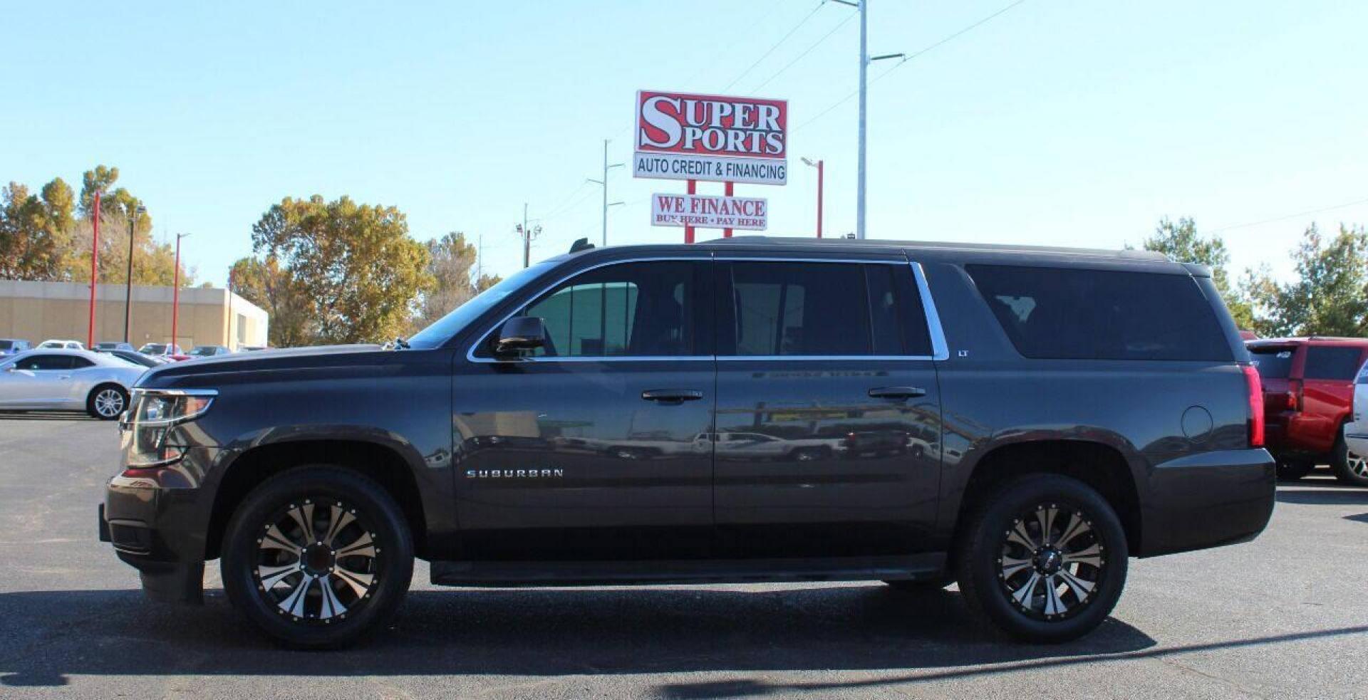 2015 Black Chevrolet Suburban LT 1500 2WD (1GNSCJKC8FR) with an 5.3L V8 OHV 16V engine, 6-Speed Automatic transmission, located at 4301 NW 39th , Oklahoma City, OK, 73112, (405) 949-5600, 35.512135, -97.598671 - NO DRIVERS LICENCE - NO FULL COVERAGE INSURANCE - NO CREDIT CHECK. COME ON OVER TO SUPERSPORTS AND TAKE A LOOK AND TEST DRIVE. PLEASE GIVE US A CALL AT (405) 949-5600. NO LICENCIA DE MANEJAR - NO SEGURO DE COBERTURA TOTAL - NO VERIFICACION DE CREDITO. POR FAVOR VENGAN A SUPERSPORTS, E - Photo#6