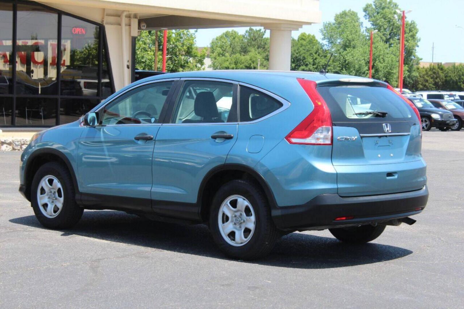 2014 Teal Honda CR-V LX 2WD 5-Speed AT (2HKRM3H33EH) with an 2.4L L4 DOHC 16V engine, 5-Speed Automatic transmission, located at 4301 NW 39th , Oklahoma City, OK, 73112, (405) 949-5600, 35.512135, -97.598671 - NO DRIVERS LICENCE NO-FULL COVERAGE INSURANCE-NO CREDIT CHECK. COME ON OVER TO SUPERSPORTS AND TAKE A LOOK AND TEST DRIVE. PLEASE GIVE US A CALL AT (405) 949-5600. NO LICENSIA DE MANEJAR- NO SEGURO DE COBERTURA TOTAL- NO VERIFICACCION DE CREDITO. POR FAVOR VENGAN A SUPERSPORTS, ECHE UN - Photo#5