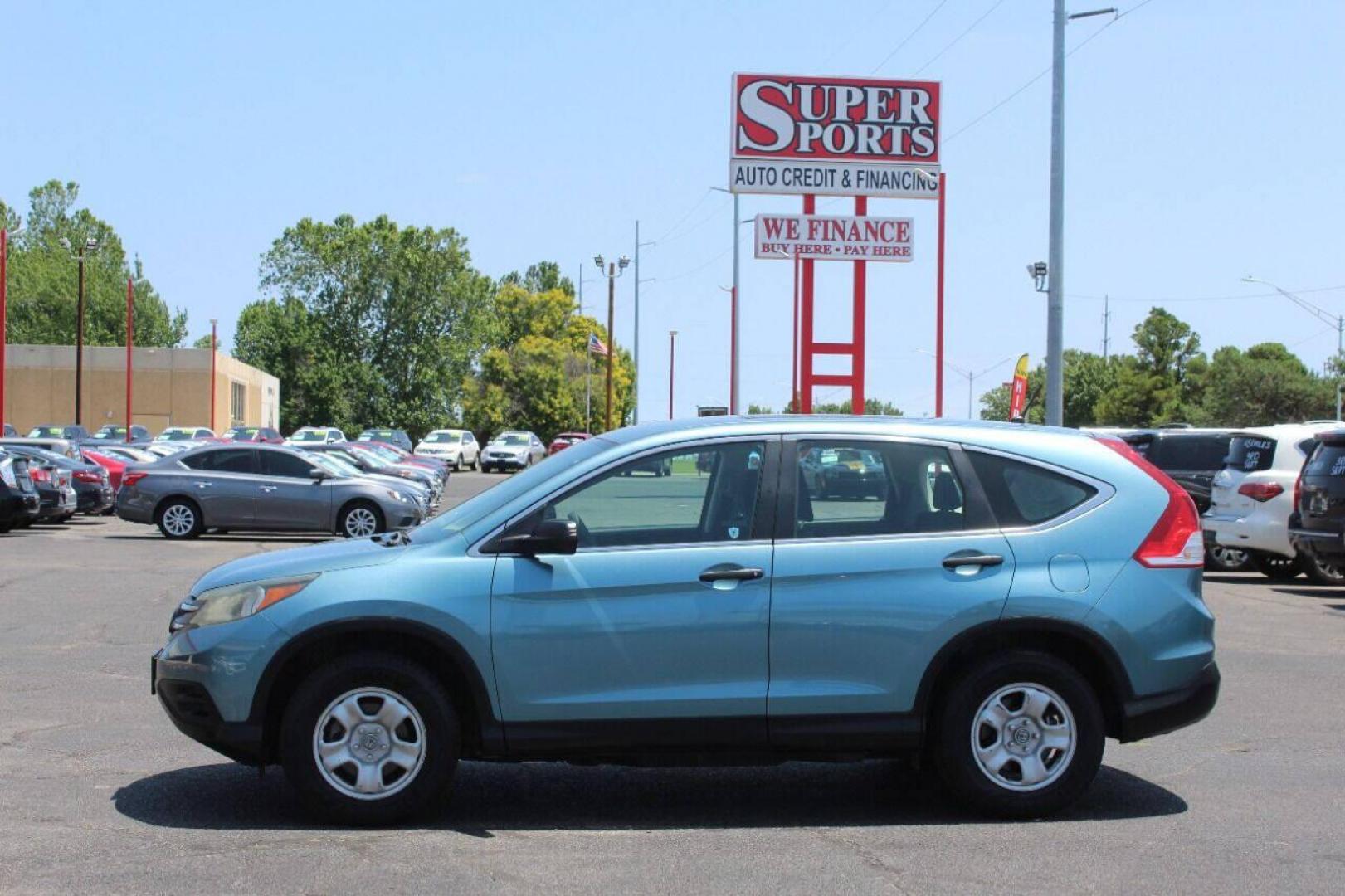 2014 Teal Honda CR-V LX 2WD 5-Speed AT (2HKRM3H33EH) with an 2.4L L4 DOHC 16V engine, 5-Speed Automatic transmission, located at 4301 NW 39th , Oklahoma City, OK, 73112, (405) 949-5600, 35.512135, -97.598671 - NO DRIVERS LICENCE NO-FULL COVERAGE INSURANCE-NO CREDIT CHECK. COME ON OVER TO SUPERSPORTS AND TAKE A LOOK AND TEST DRIVE. PLEASE GIVE US A CALL AT (405) 949-5600. NO LICENSIA DE MANEJAR- NO SEGURO DE COBERTURA TOTAL- NO VERIFICACCION DE CREDITO. POR FAVOR VENGAN A SUPERSPORTS, ECHE UN - Photo#6