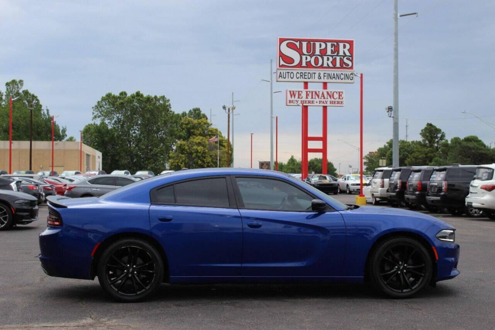 2018 Blue Dodge Charger SE (2C3CDXBG9JH) with an 3.6L V6 DOHC 24V engine, 8A transmission, located at 4301 NW 39th , Oklahoma City, OK, 73112, (405) 949-5600, 35.512135, -97.598671 - NO DRIVERS LICENSE - NO FULL COVERAGE INSURANCE - NO CREDIT CHECK. COME ON OVER TO SUPERSPORTS AND TAKE A LOOK AND TEST DRIVE PLEASE GIVE US A CALL AT (405) 949-5600. NO LICENCIA DE MANEJAR - NO SEGURO DE COBERTURA TOTAL - NO VERIFICACION DE CREDITO. POR FAVOR VENGAN A SUPERSPORTS, ECHE - Photo#3