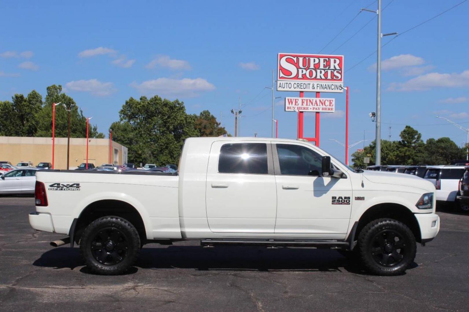 2016 Off White RAM 2500 Laramie Mega Cab 4WD (3C6UR5NJXGG) with an 6.4L V8 engine, 6A transmission, located at 4301 NW 39th , Oklahoma City, OK, 73112, (405) 949-5600, 35.512135, -97.598671 - NO DRIVERS LICENCE NO-FULL COVERAGE INSURANCE-NO CREDIT CHECK. COME ON OVER TO SUPERSPORTS AND TAKE A LOOK AND TEST DRIVE. PLEASE GIVE US A CALL AT (405) 949-5600. NO LICENSIA DE MANEJAR- NO SEGURO DE COBERTURA TOTAL- NO VERIFICACCION DE CREDITO. POR FAVOR VENGAN A SUPERSPORTS, ECHE UN - Photo#3