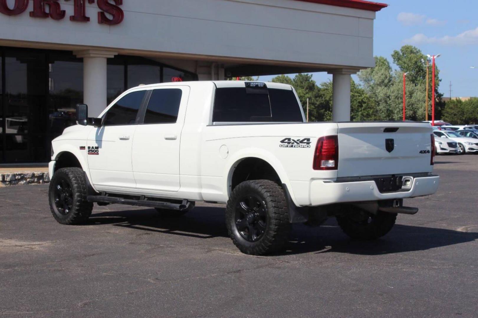 2016 Off White RAM 2500 Laramie Mega Cab 4WD (3C6UR5NJXGG) with an 6.4L V8 engine, 6A transmission, located at 4301 NW 39th , Oklahoma City, OK, 73112, (405) 949-5600, 35.512135, -97.598671 - NO DRIVERS LICENCE NO-FULL COVERAGE INSURANCE-NO CREDIT CHECK. COME ON OVER TO SUPERSPORTS AND TAKE A LOOK AND TEST DRIVE. PLEASE GIVE US A CALL AT (405) 949-5600. NO LICENSIA DE MANEJAR- NO SEGURO DE COBERTURA TOTAL- NO VERIFICACCION DE CREDITO. POR FAVOR VENGAN A SUPERSPORTS, ECHE UN - Photo#5