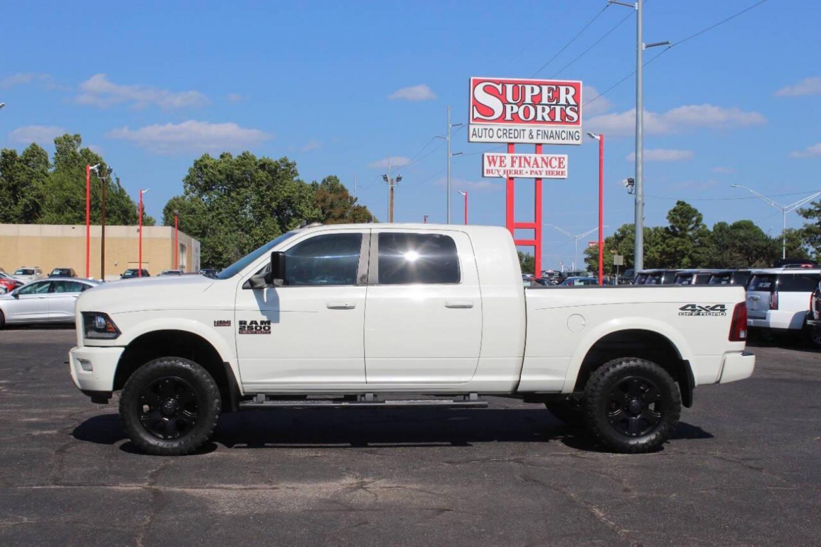 2016 Off White RAM 2500 Laramie Mega Cab 4WD (3C6UR5NJXGG) with an 6.4L V8 engine, 6A transmission, located at 4301 NW 39th , Oklahoma City, OK, 73112, (405) 949-5600, 35.512135, -97.598671 - NO DRIVERS LICENCE NO-FULL COVERAGE INSURANCE-NO CREDIT CHECK. COME ON OVER TO SUPERSPORTS AND TAKE A LOOK AND TEST DRIVE. PLEASE GIVE US A CALL AT (405) 949-5600. NO LICENSIA DE MANEJAR- NO SEGURO DE COBERTURA TOTAL- NO VERIFICACCION DE CREDITO. POR FAVOR VENGAN A SUPERSPORTS, ECHE UN - Photo#6